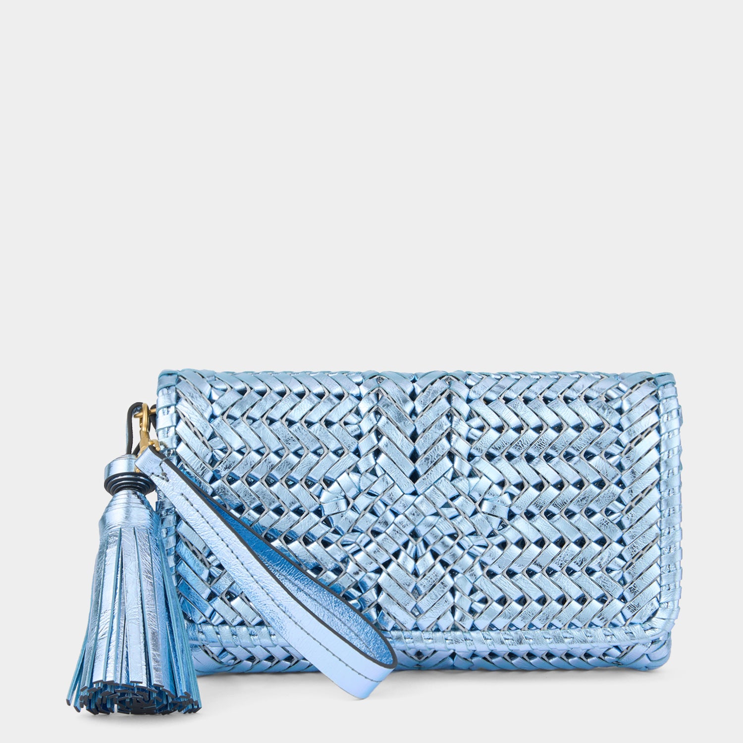 Metallic blue handwoven leather clutch by Anya Hindmarch