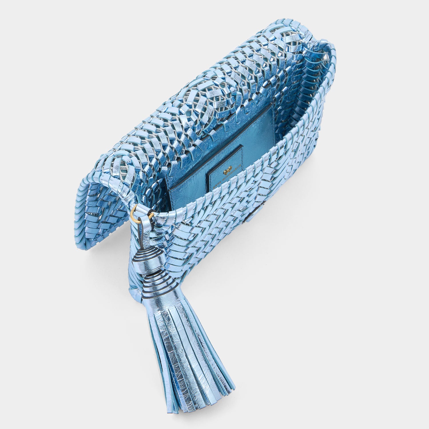 Metallic blue handwoven leather clutch by Anya Hindmarch
