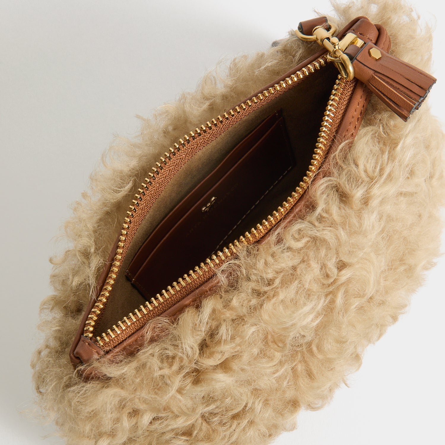Shearling Eyes Clutch -

          
            Shearling/Smooth Leather leather in Taupe -
          

          Anya Hindmarch UK
