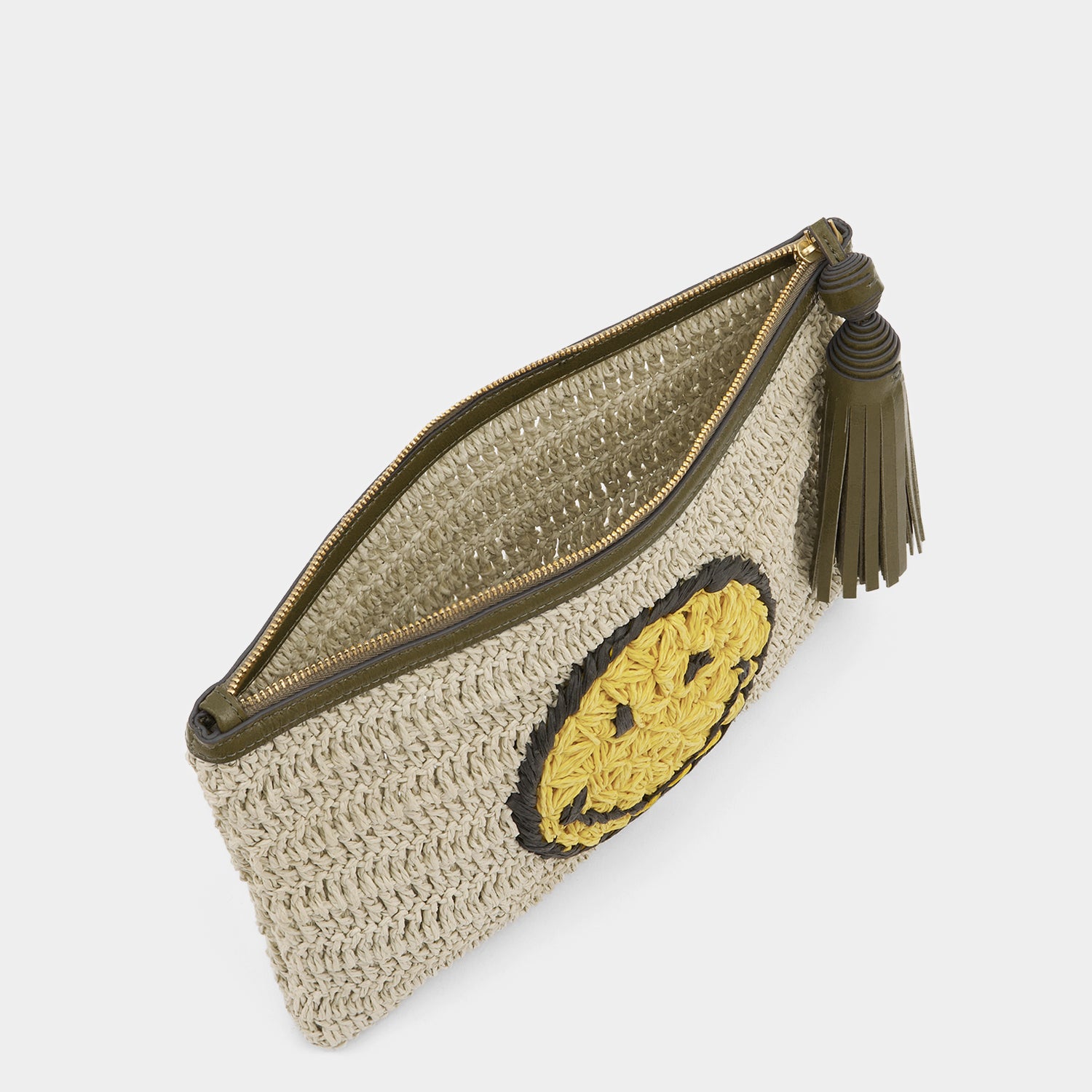Raffia pochette with winky emoji by Anya Hindmarch