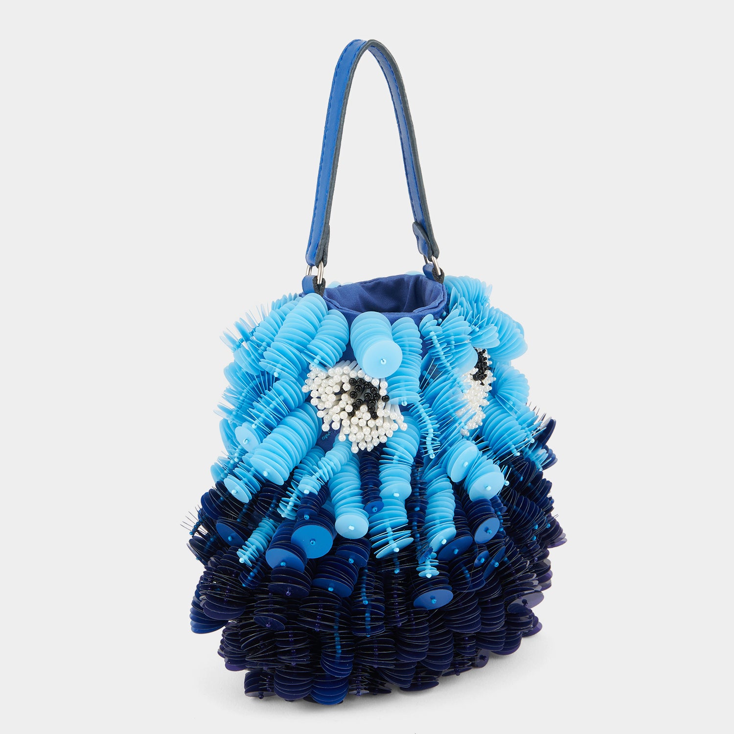 Blue beaded crossbody bag shaped like a fish by Anya Hindmarch