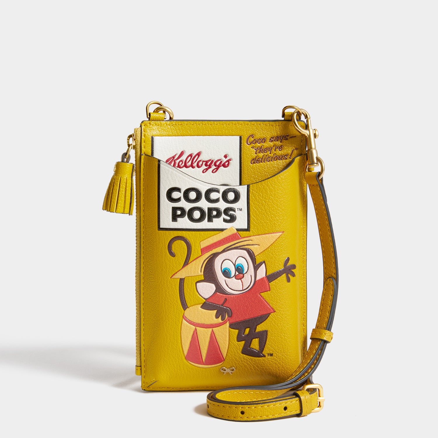 Anya Brands Coco Pops Zip Phone Pouch -

          
            Shiny Capra Leather in Mustard -
          

          Anya Hindmarch UK
