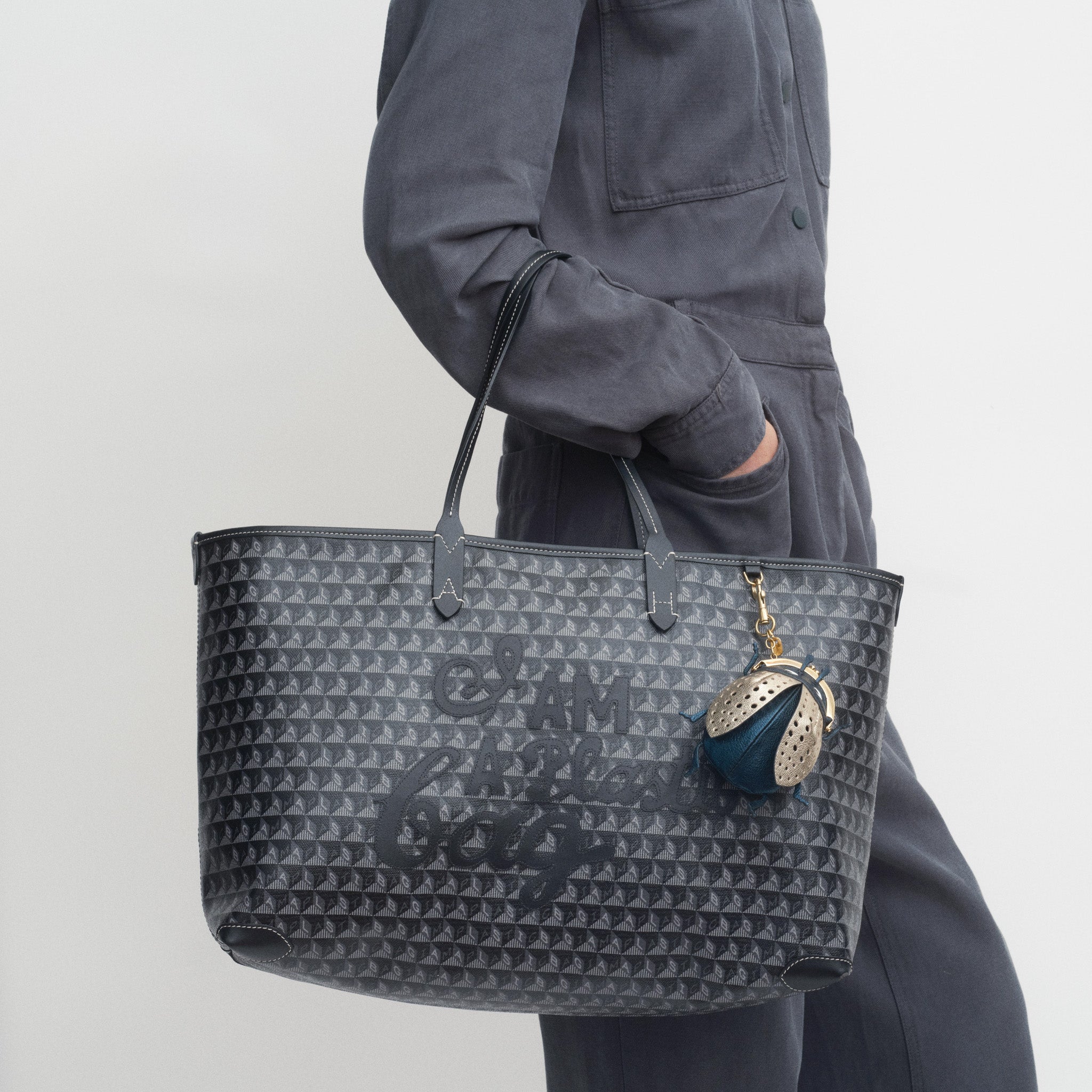 I Am A Plastic Bag Zipped Motif Tote -

          
            Recycled Canvas in Black -
          

          Anya Hindmarch UK
