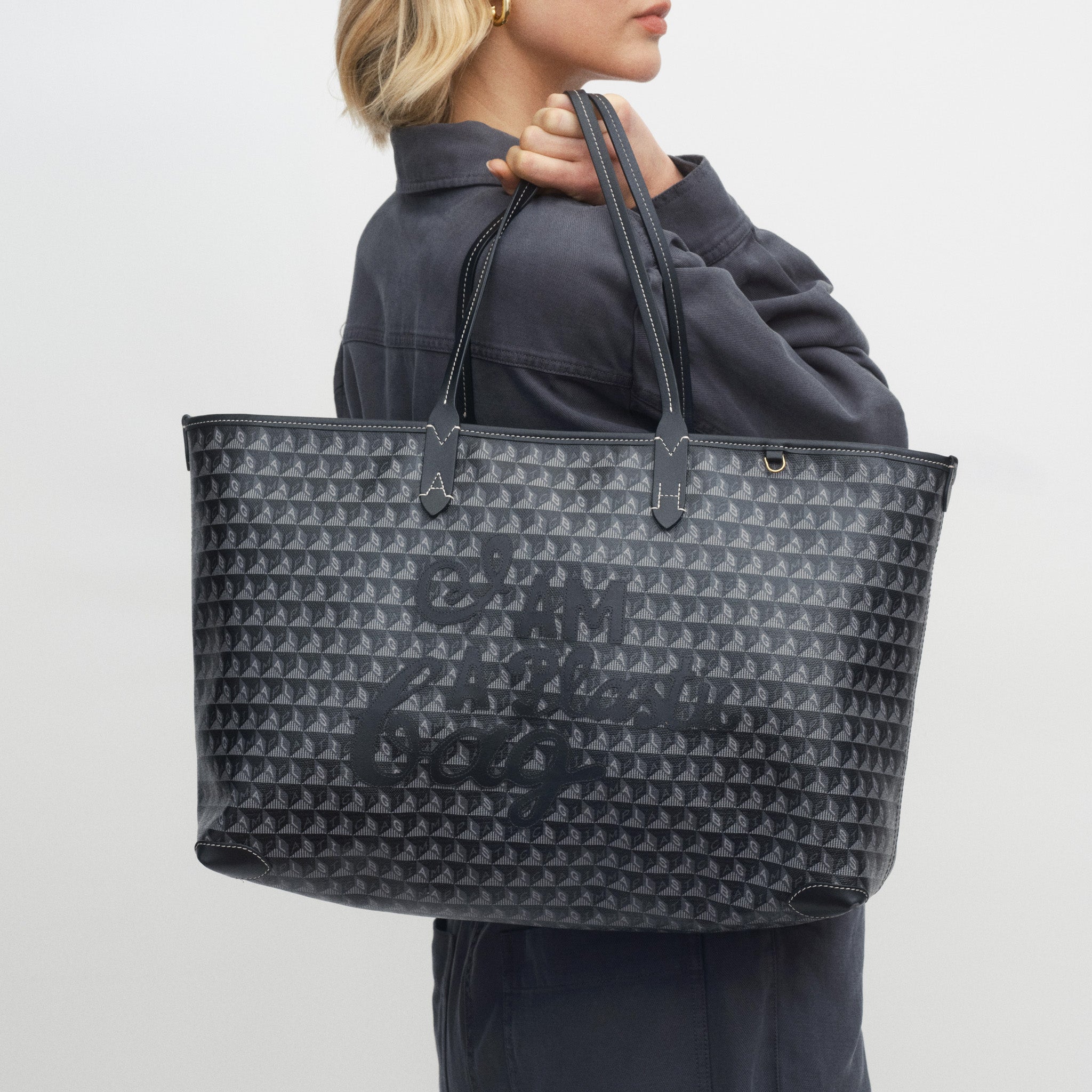 I Am A Plastic Bag Zipped Motif Tote -

          
            Recycled Canvas in Black -
          

          Anya Hindmarch UK
