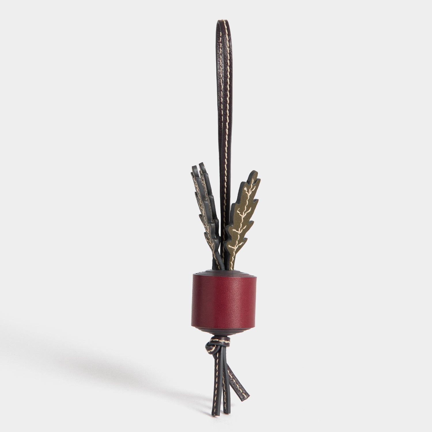 Return to Nature Radish Charm -

          
            Compostable Leather in Resewood red -
          

          Anya Hindmarch UK
