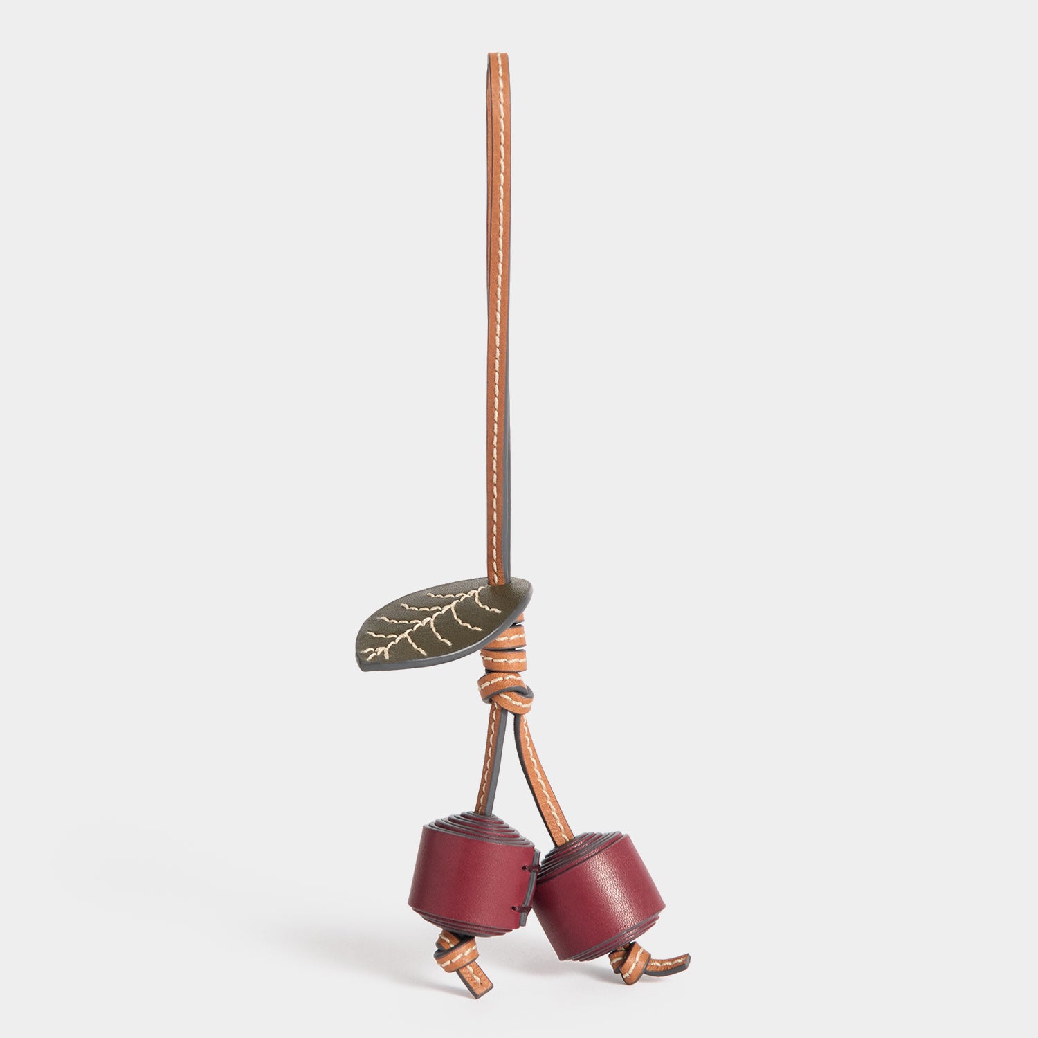 Return to Nature Cherry Charm -

          
            Compostable Leather in Pecan -
          

          Anya Hindmarch UK
