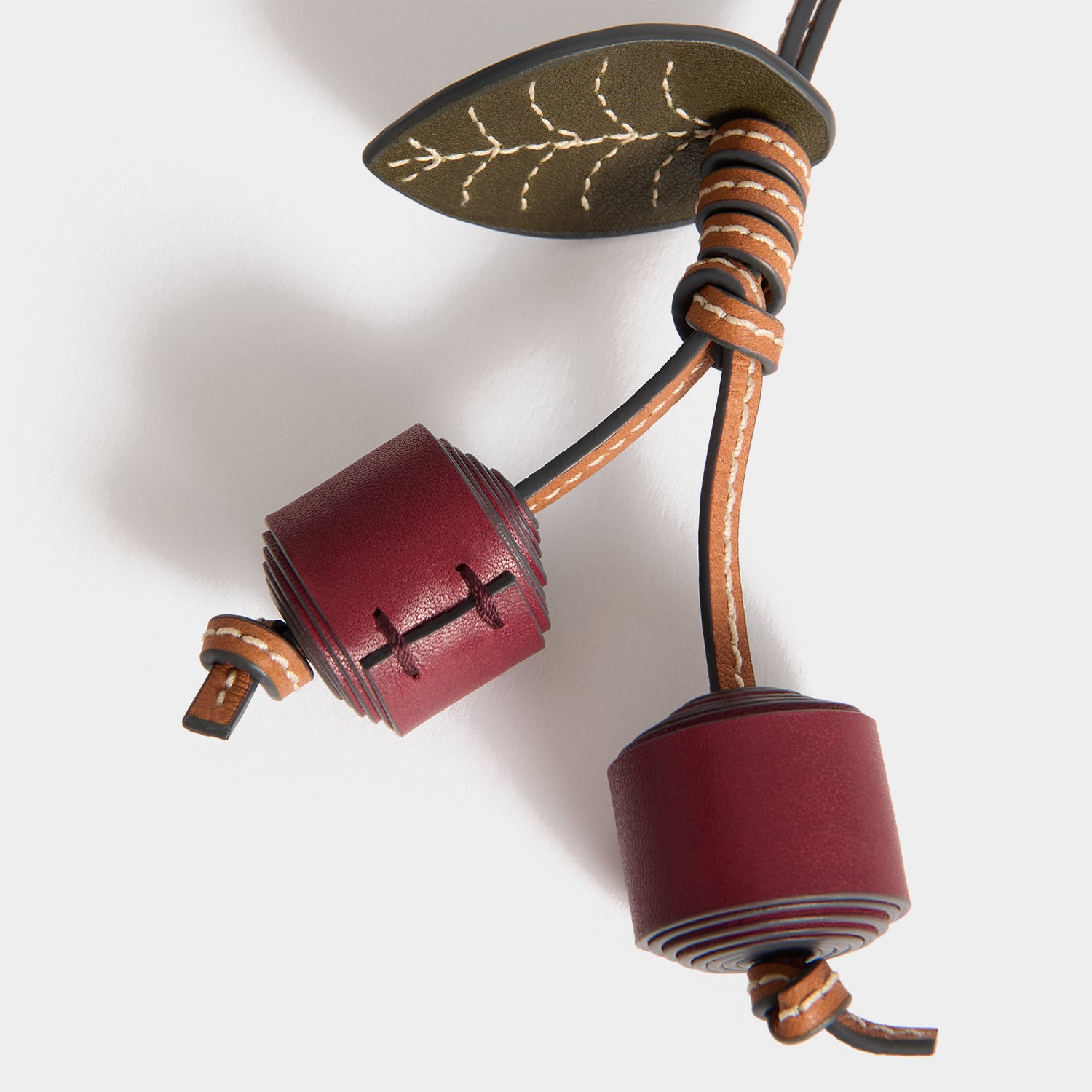 Return to Nature Cherry Charm -

          
            Compostable Leather in Pecan -
          

          Anya Hindmarch UK
