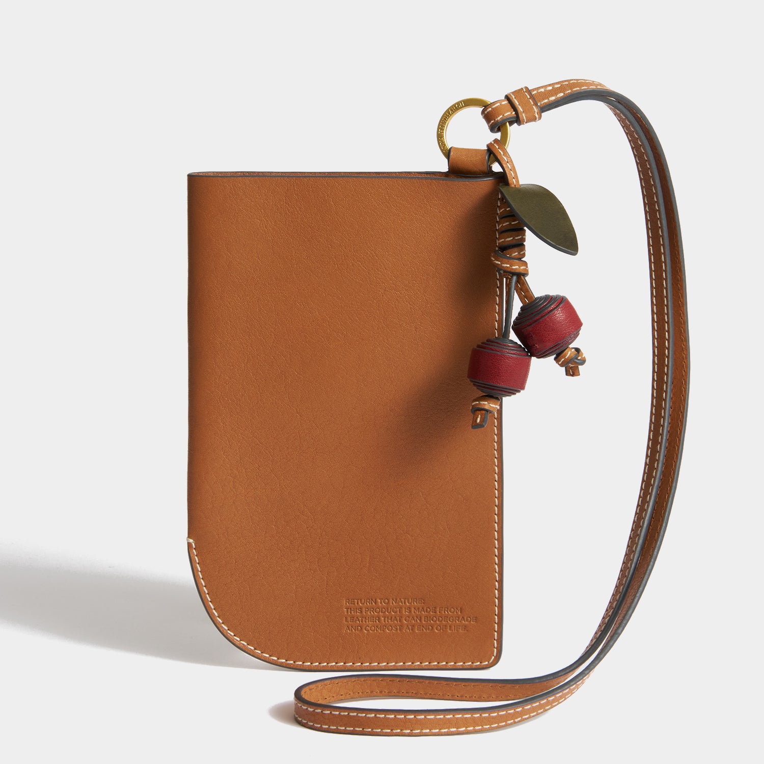 Return To Nature Strap Phone Pouch -

          
            Natural Grain Leather in Pecan -
          

          Anya Hindmarch UK
