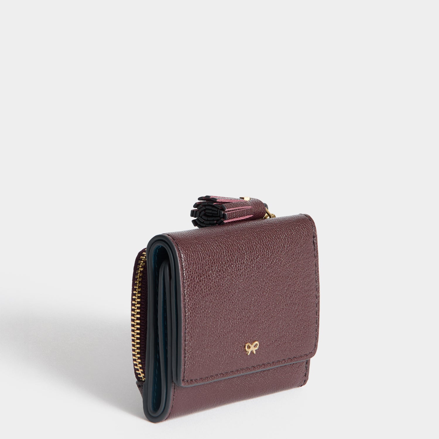Peeping Eyes Mini Trifold Wallet -

          
            Capra Leather in Claret -
          

          Anya Hindmarch UK
