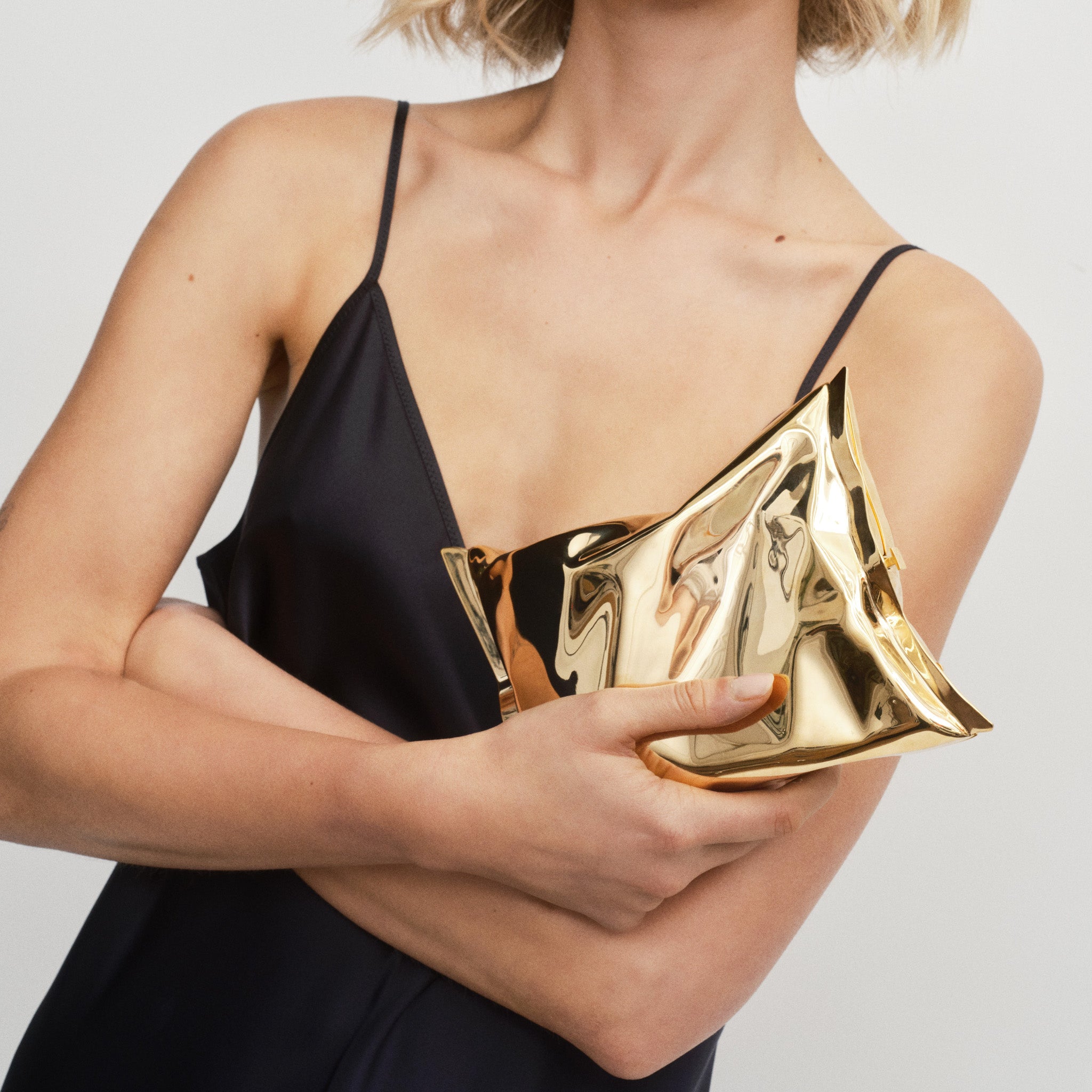 Crisp Packet Clutch -

          
            Brass in Pale Gold -
          

          Anya Hindmarch UK
