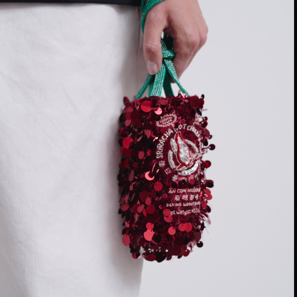 Anya Brands Flying Goose Sriracha Mini Bucket Bag -

          
            Satin/Sequins in Oxblood Red -
          

          Anya Hindmarch UK
