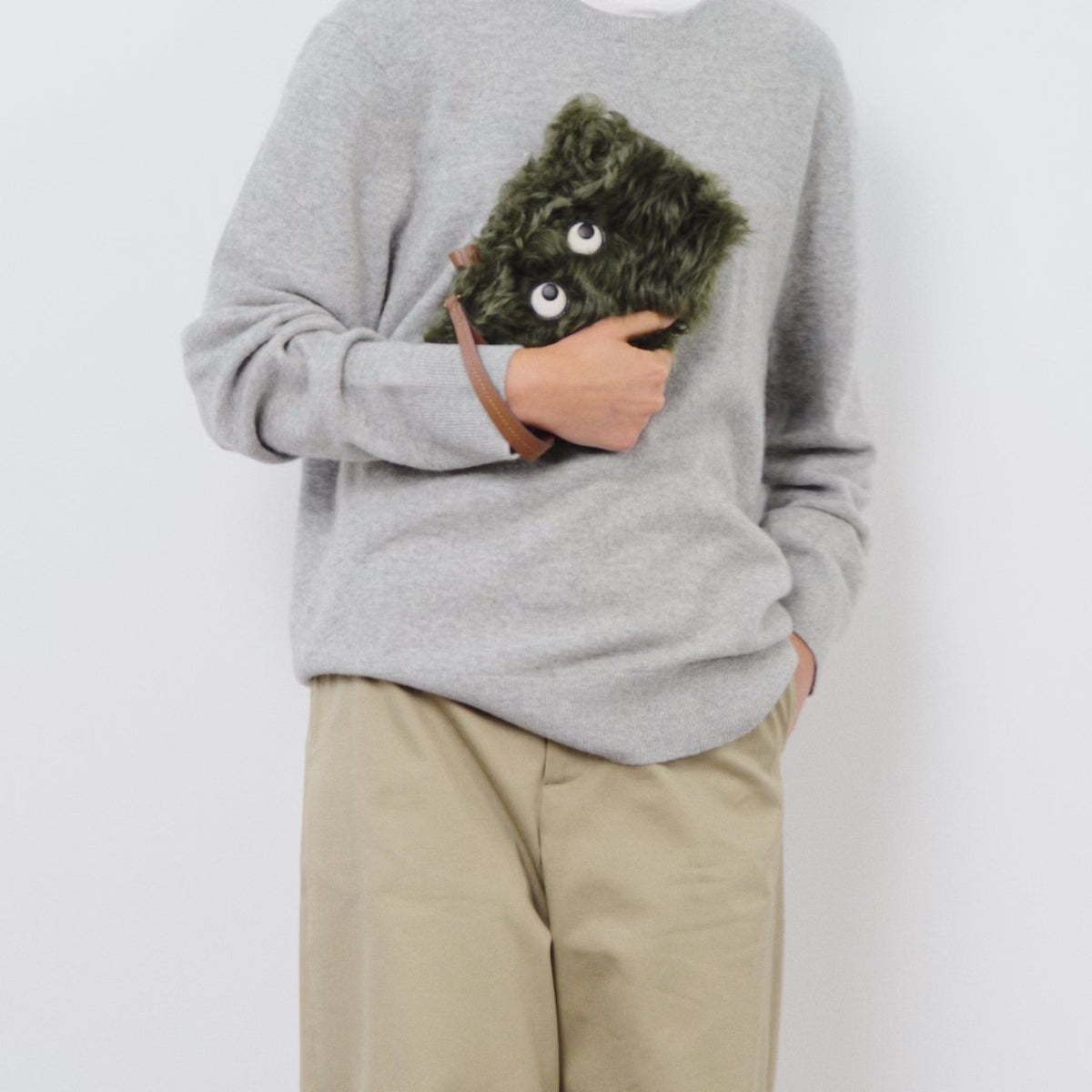 Shearling Eyes Clutch -

          
            Shearling/Smooth Leather in Khaki Green -
          

          Anya Hindmarch UK
