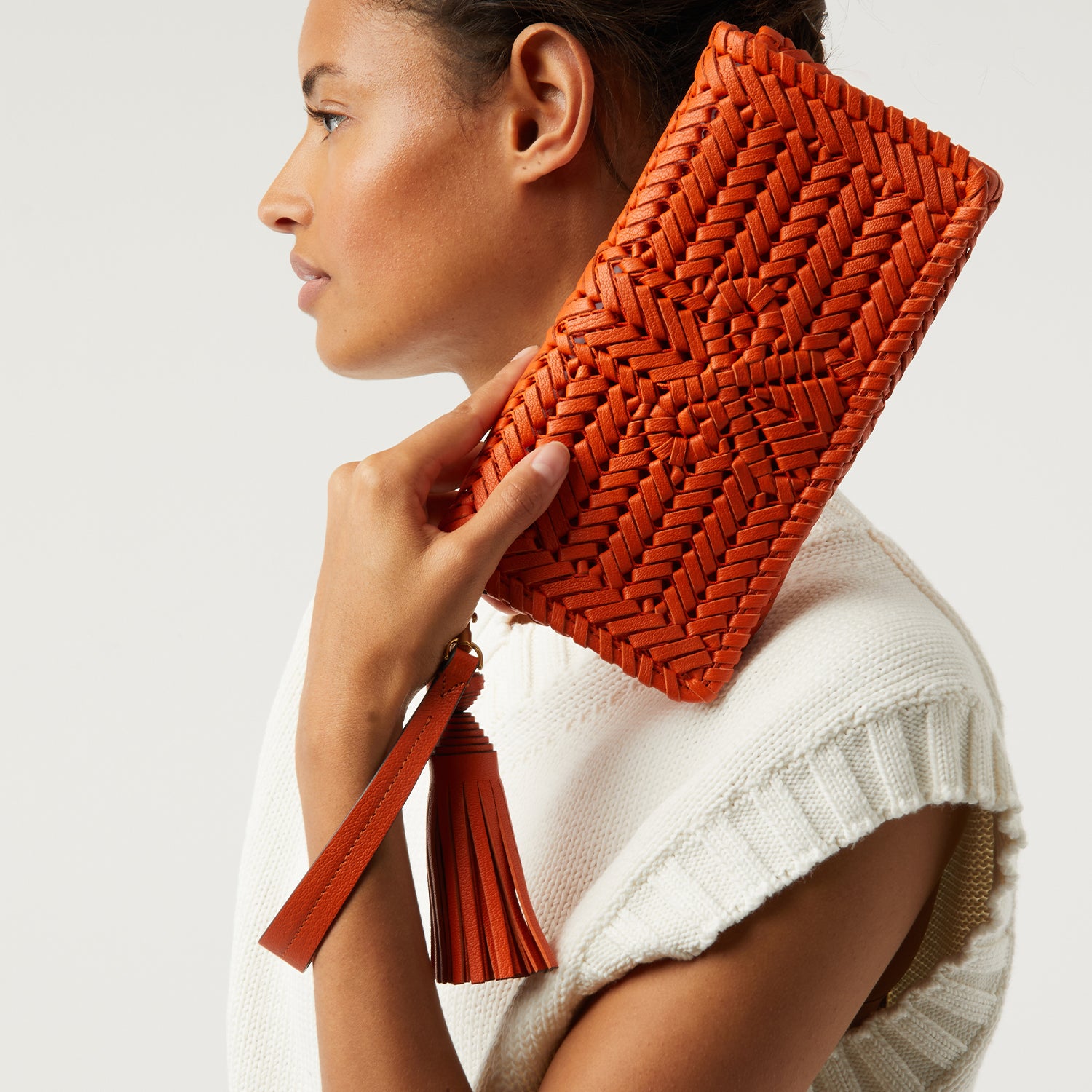 Neeson Tassel Clutch -

                  
                    Capra Leather in Ginger -
                  

                  Anya Hindmarch UK
