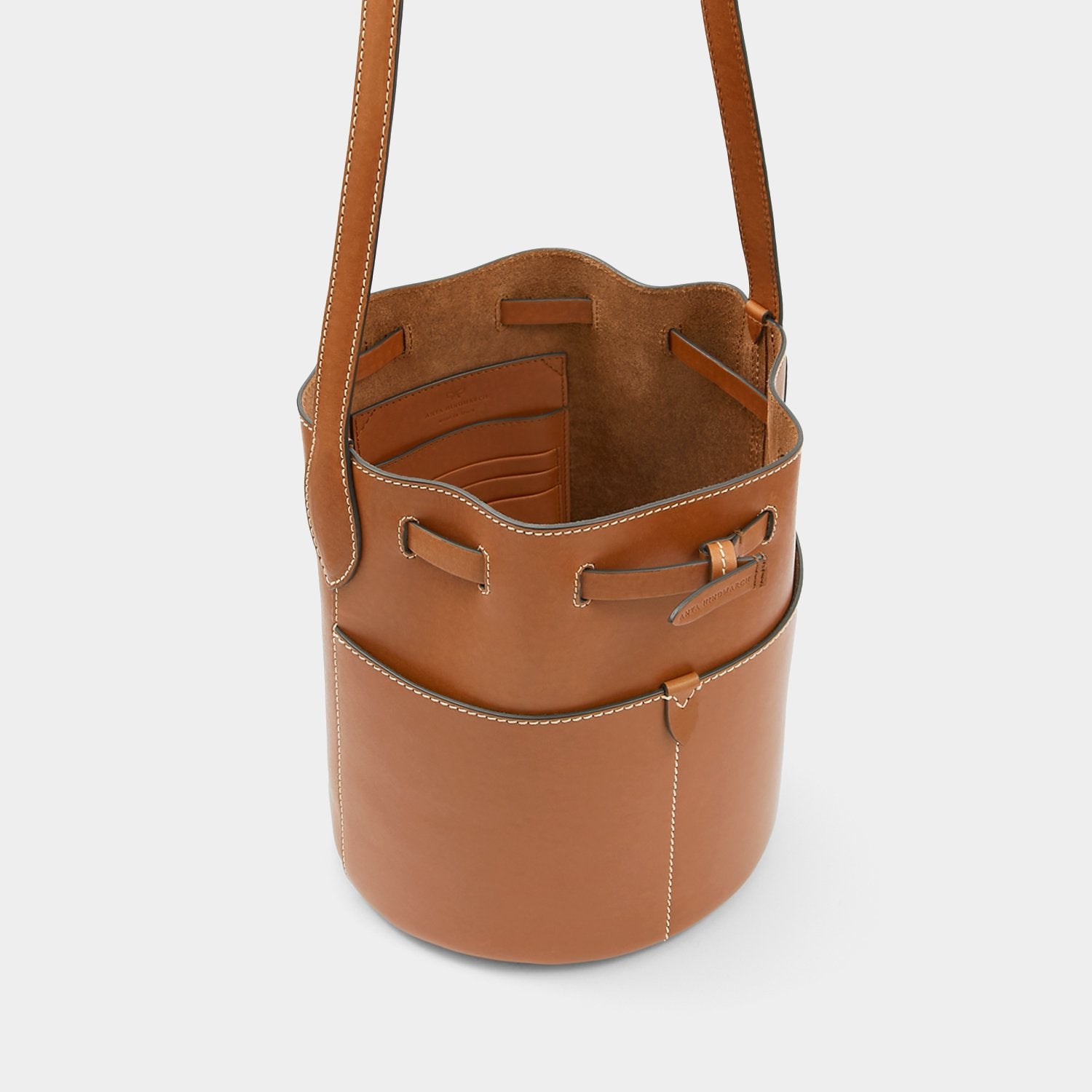 Return to Nature Small Bucket Bag -

                  
                    Compostable Leather in Tan -
                  

                  Anya Hindmarch UK
