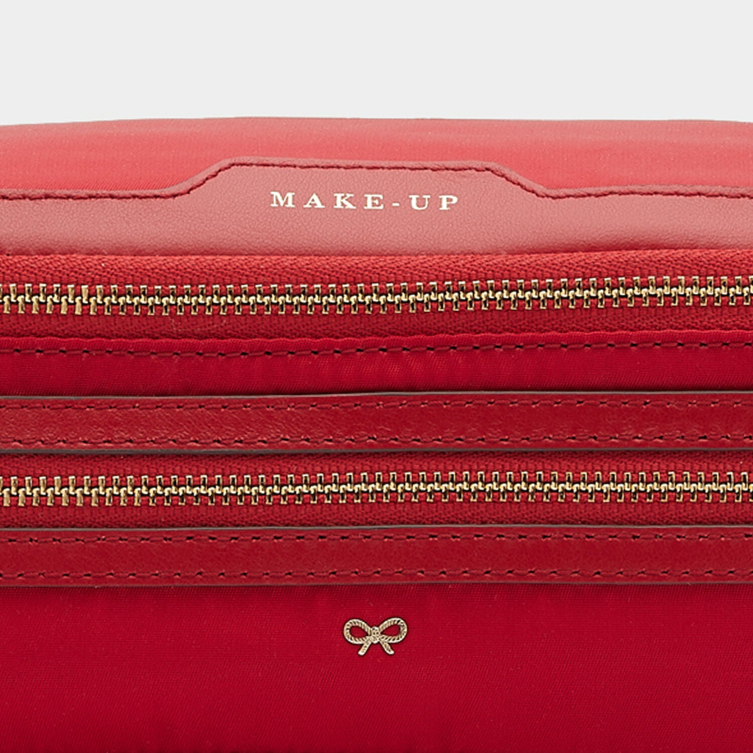 Make-Up Pouch -

                  
                    Recycled Nylon in Red -
                  

                  Anya Hindmarch UK

