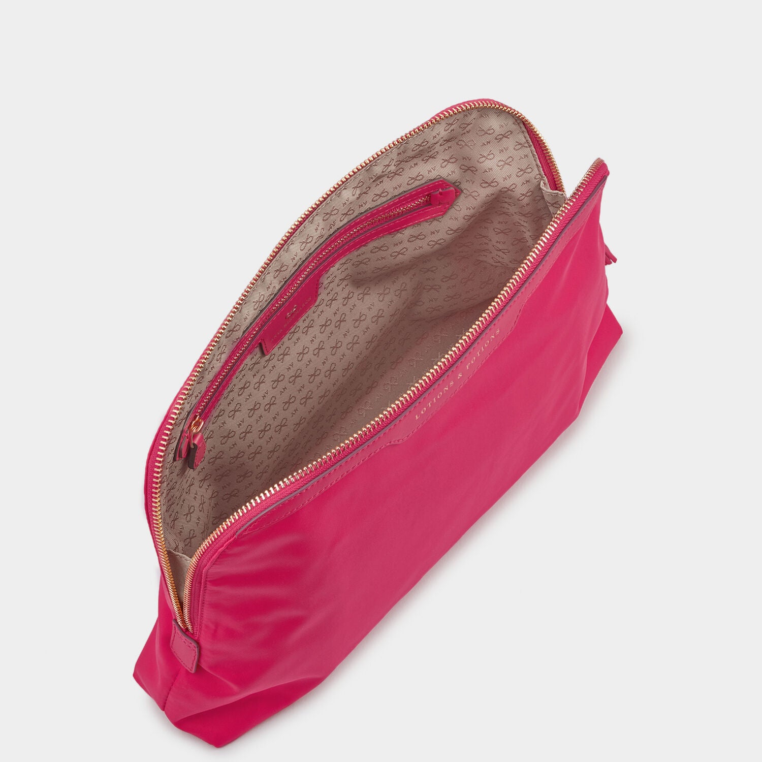 Lotions and Potions Pouch -

                  
                    Econyl® in Hot Pink -
                  

                  Anya Hindmarch UK
