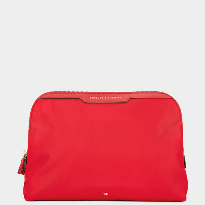 Lotions and Potions Pouch -

                  
                    ECONYL® in Red -
                  

                  Anya Hindmarch UK
