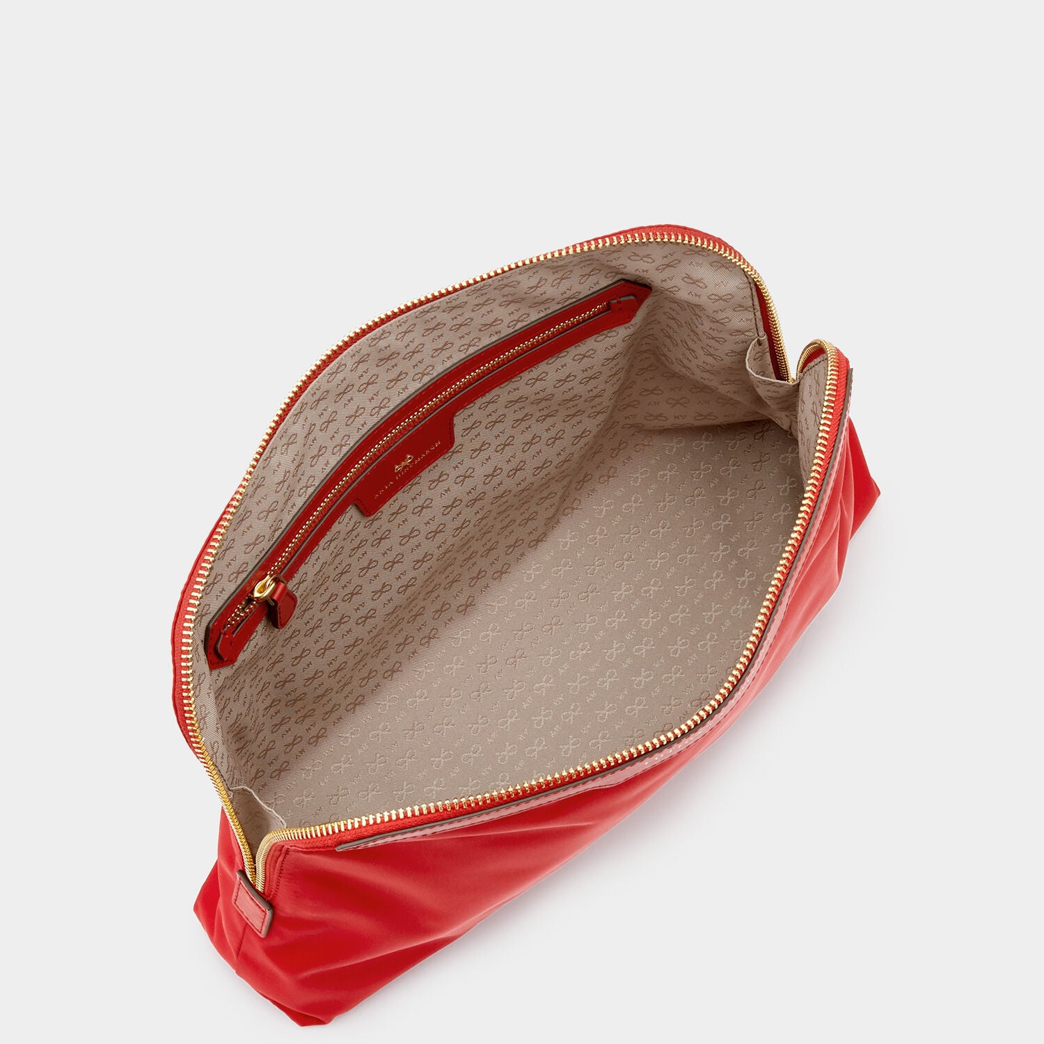 Lotions and Potions Pouch -

                  
                    ECONYL® in Red -
                  

                  Anya Hindmarch UK
