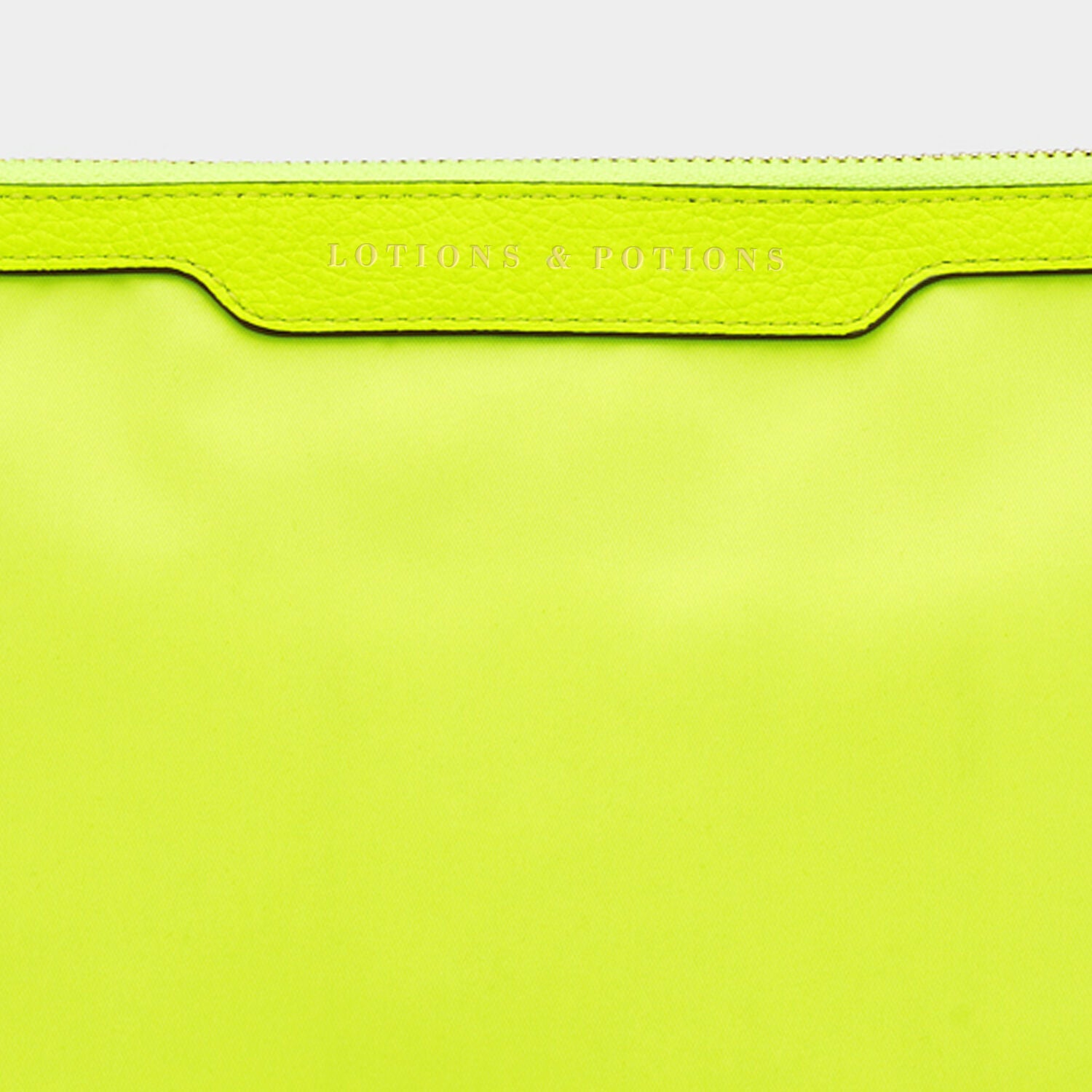 Lotions and Potions Pouch -

                  
                    ECONYL® in Neon Yellow -
                  

                  Anya Hindmarch UK
