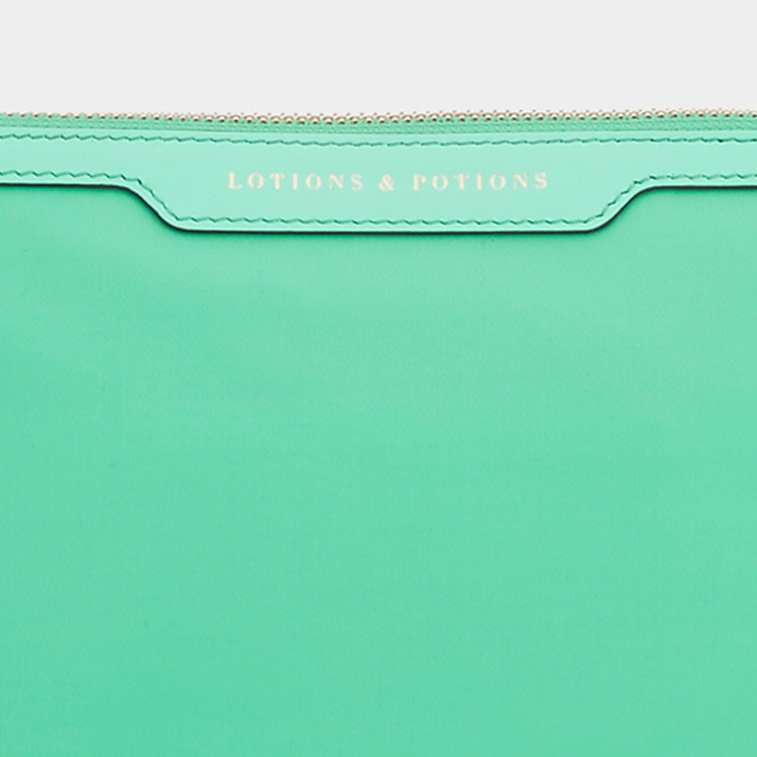 Lotions and Potions Pouch -

                  
                    ECONYL® in Arsenic -
                  

                  Anya Hindmarch UK
