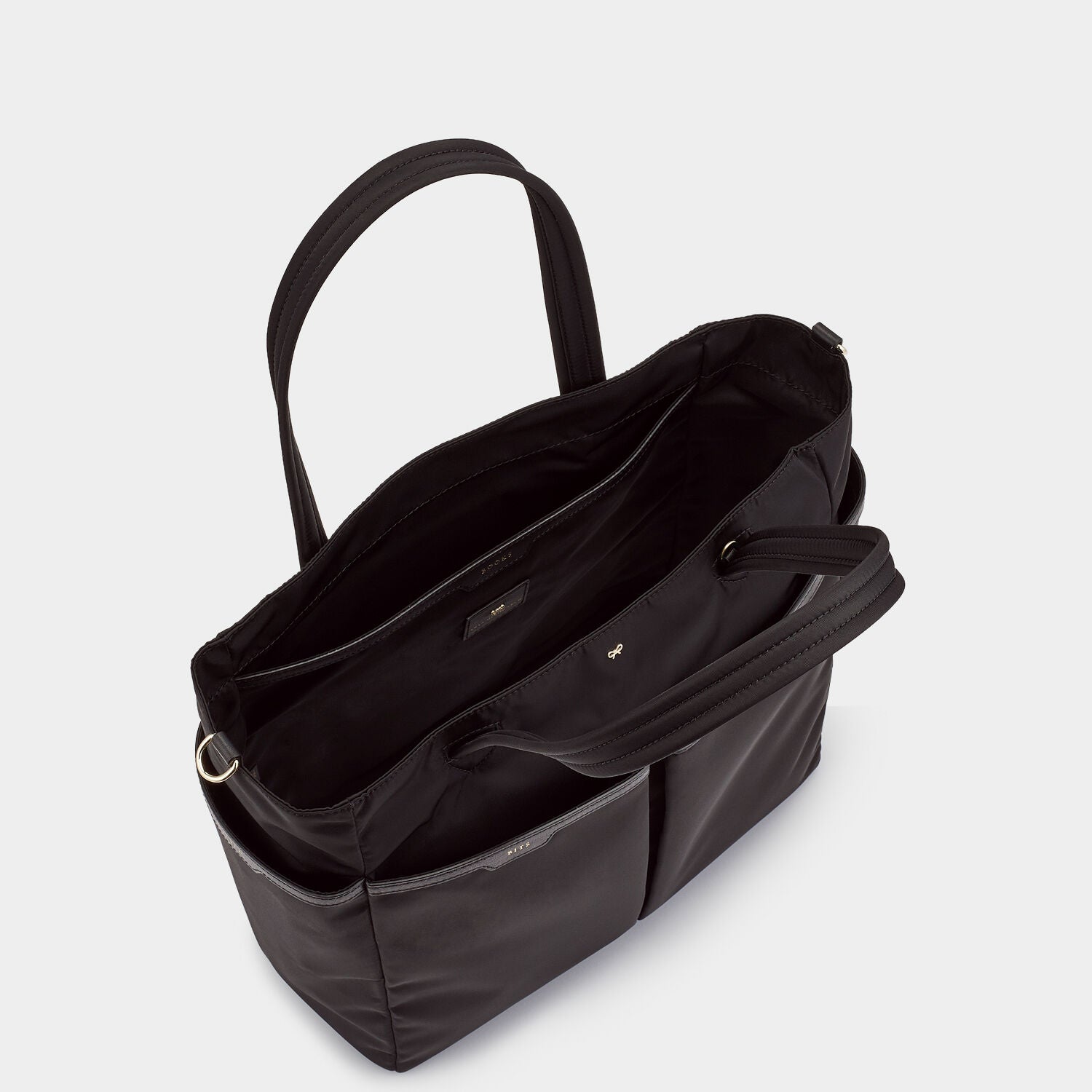 Baby Bag -

                  
                    Econyl® Regenerated Nylon in Black -
                  

                  Anya Hindmarch UK
