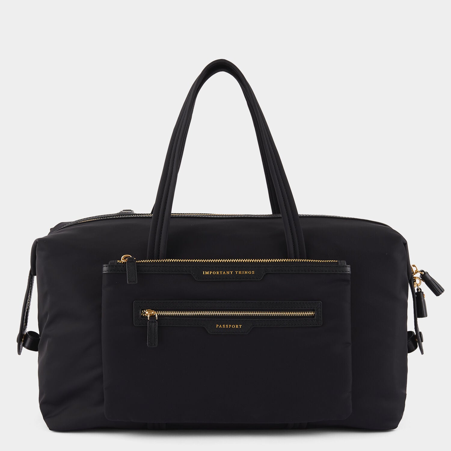 In-Flight Travel Bag -

                  
                    Regenerated Econyl® in Black -
                  

                  Anya Hindmarch UK
