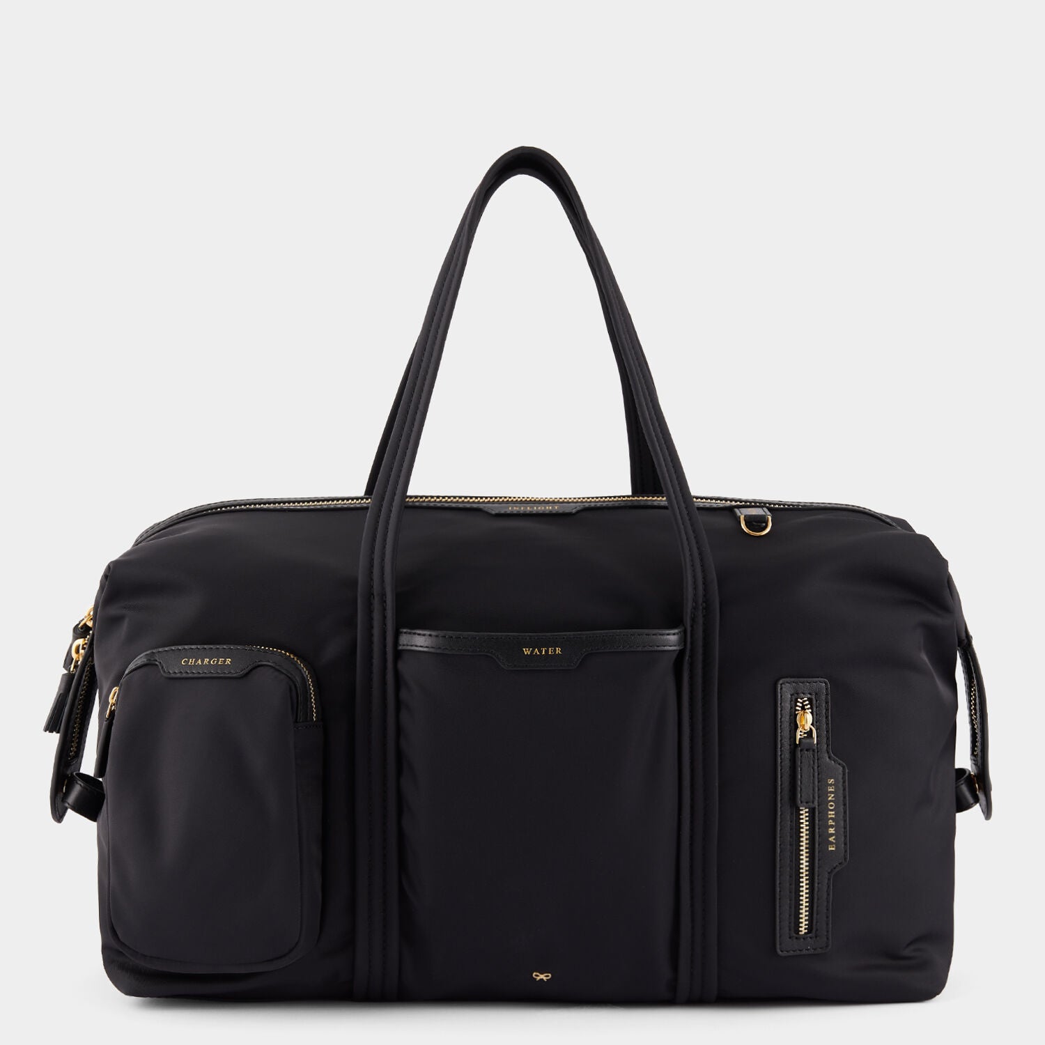 In-Flight Travel Bag -

                  
                    Regenerated Econyl® in Black -
                  

                  Anya Hindmarch UK
