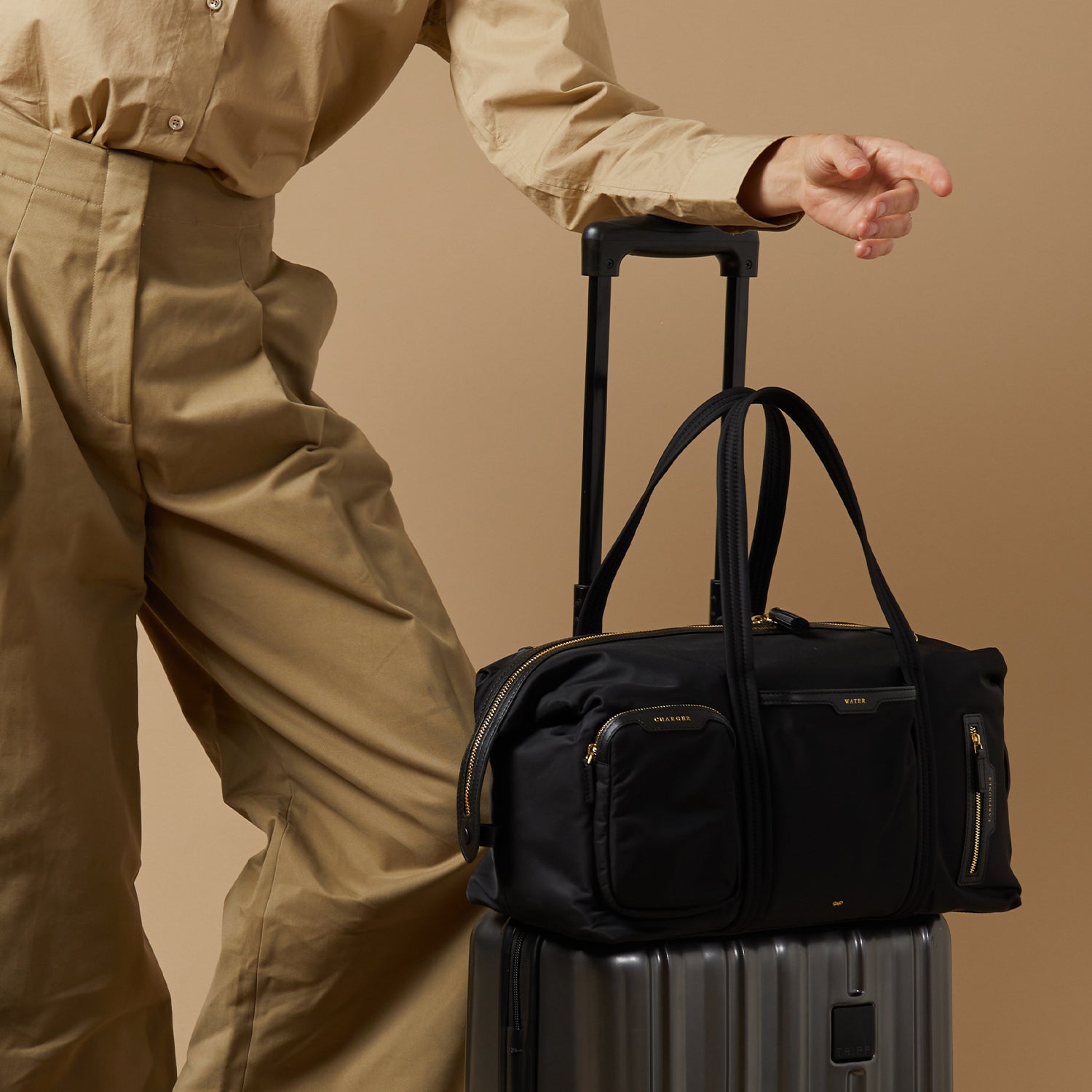 In-Flight Bag -

                  
                    Regenerated ECONYL® in Black -
                  

                  Anya Hindmarch UK
