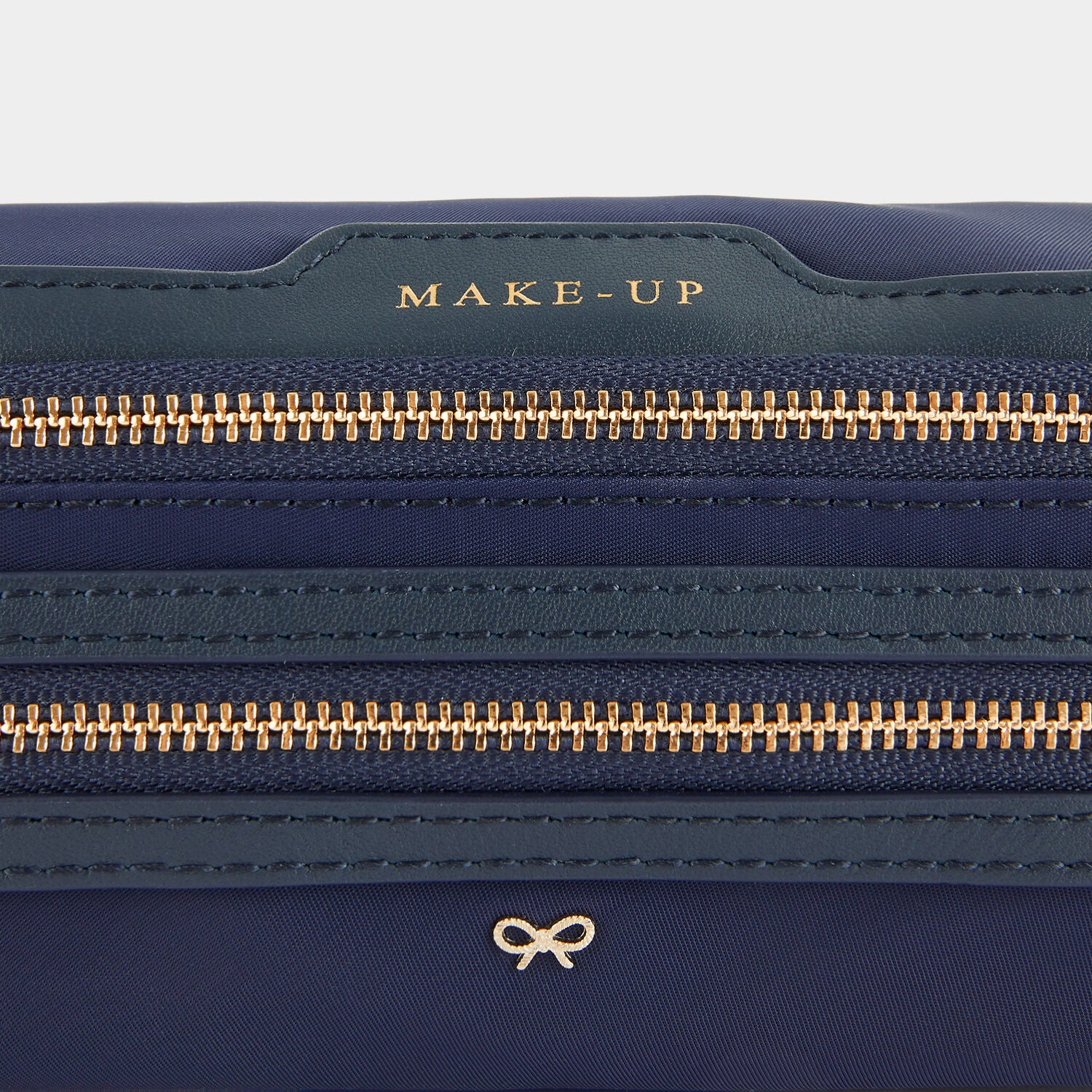 Make-Up Pouch -

                  
                    ECONYL® Regenerated Nylon in Dark Marine -
                  

                  Anya Hindmarch UK
