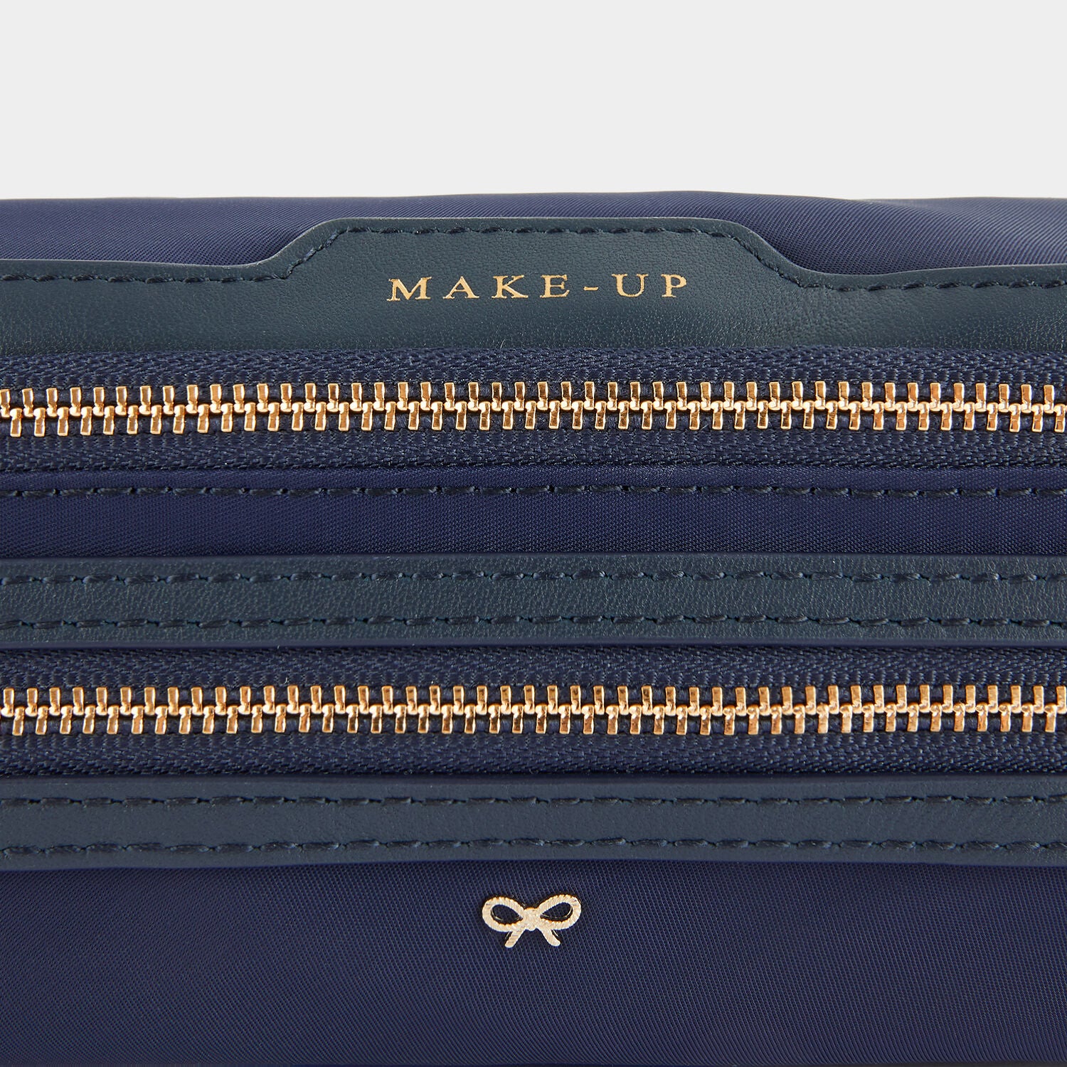 Make-Up Pouch -

                  
                    Econyl® Regenerated Nylon in Dark Marine -
                  

                  Anya Hindmarch UK
