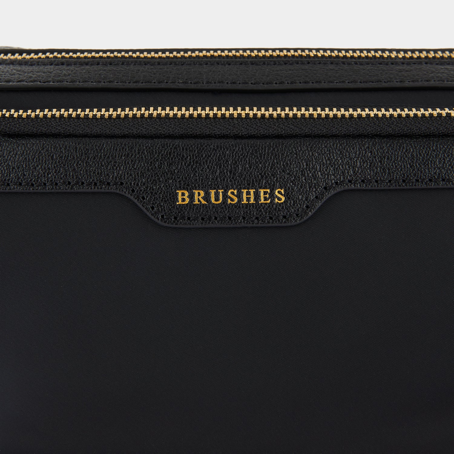Small Make-Up Pouch -

                  
                    ECONYL® regenerated Nylon in Black -
                  

                  Anya Hindmarch UK
