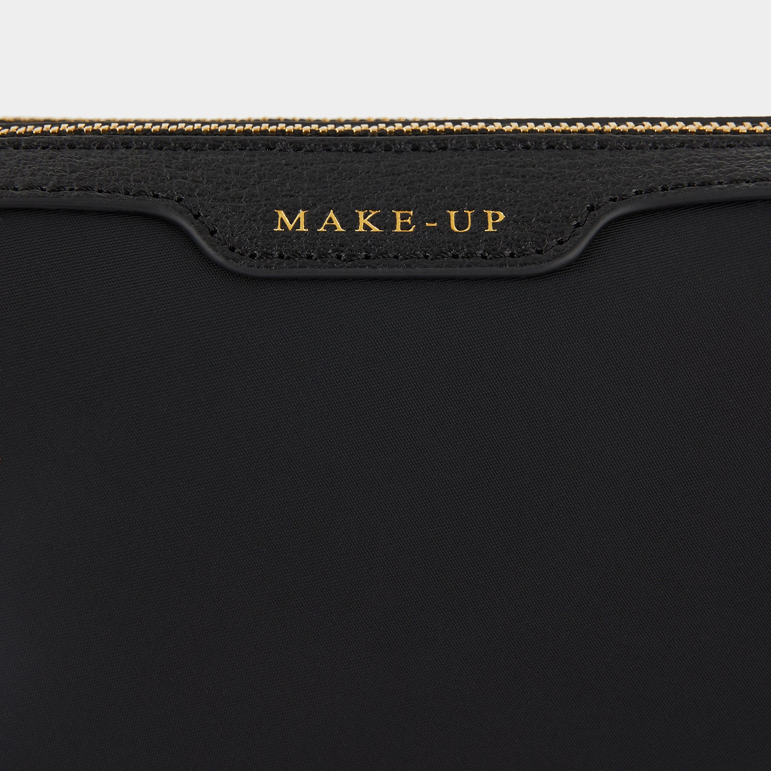 Small Make-Up Pouch -

                  
                    ECONYL® regenerated Nylon in Black -
                  

                  Anya Hindmarch UK
