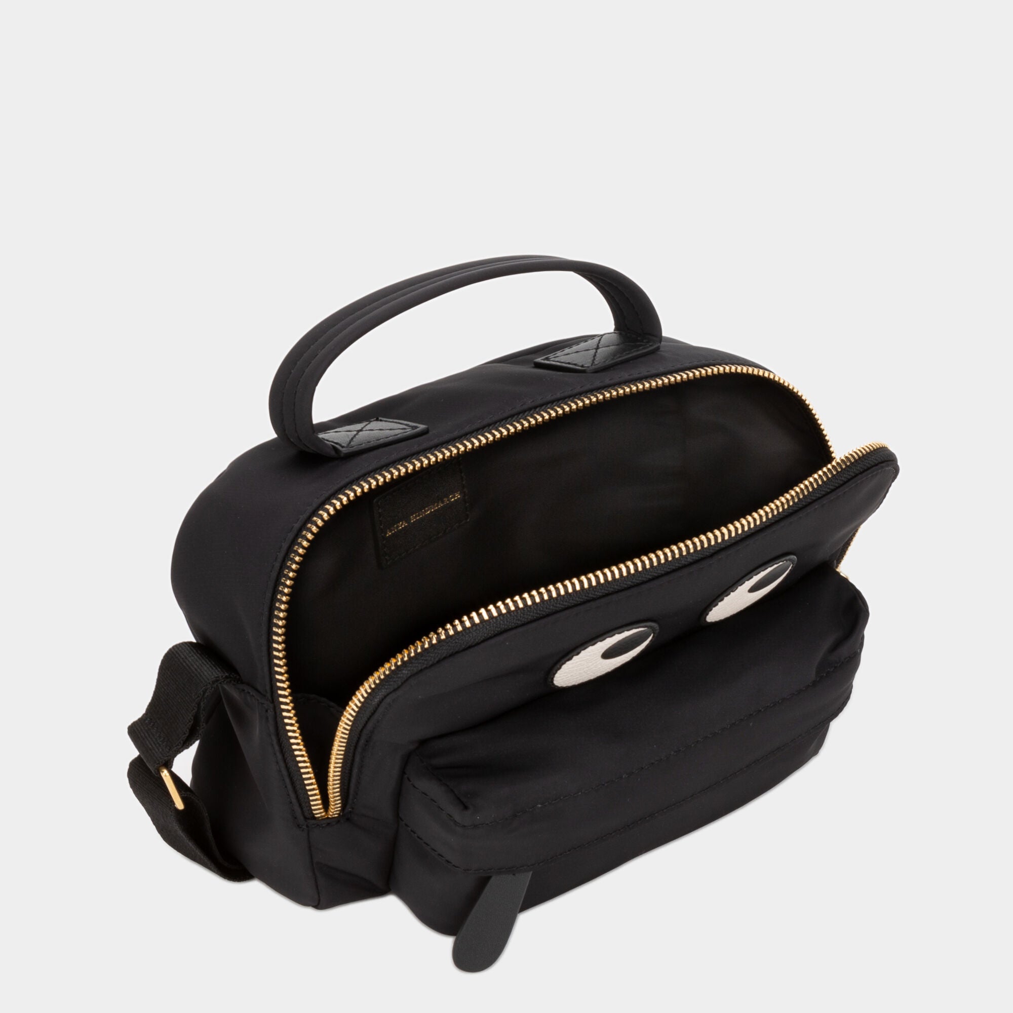 Eyes Cross-body Pouch -

                  
                    ECONYL® Regenerated Nylon in Black -
                  

                  Anya Hindmarch UK
