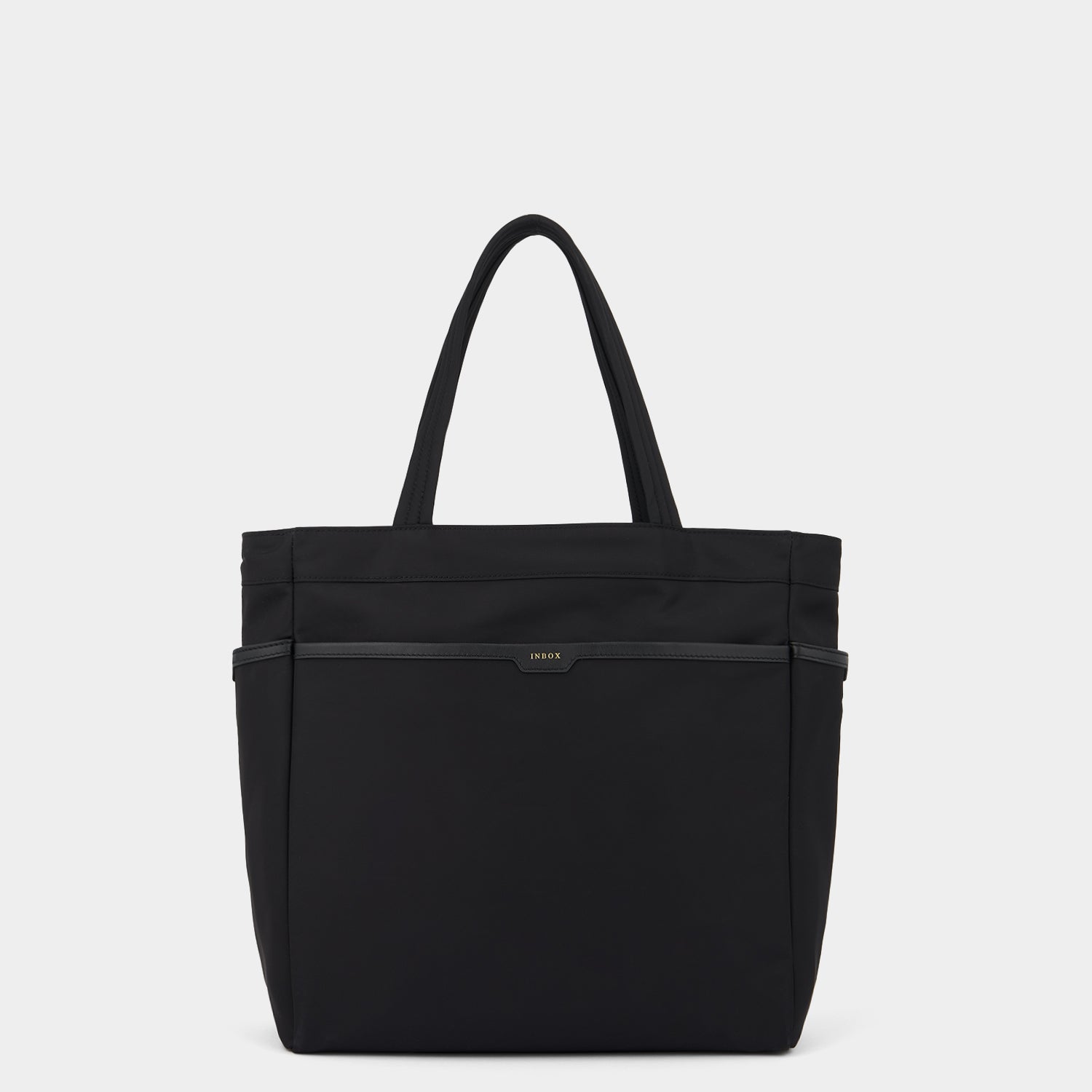 Commuter Tote -

                  
                    Regenerated Econyl® in Black -
                  

                  Anya Hindmarch UK
