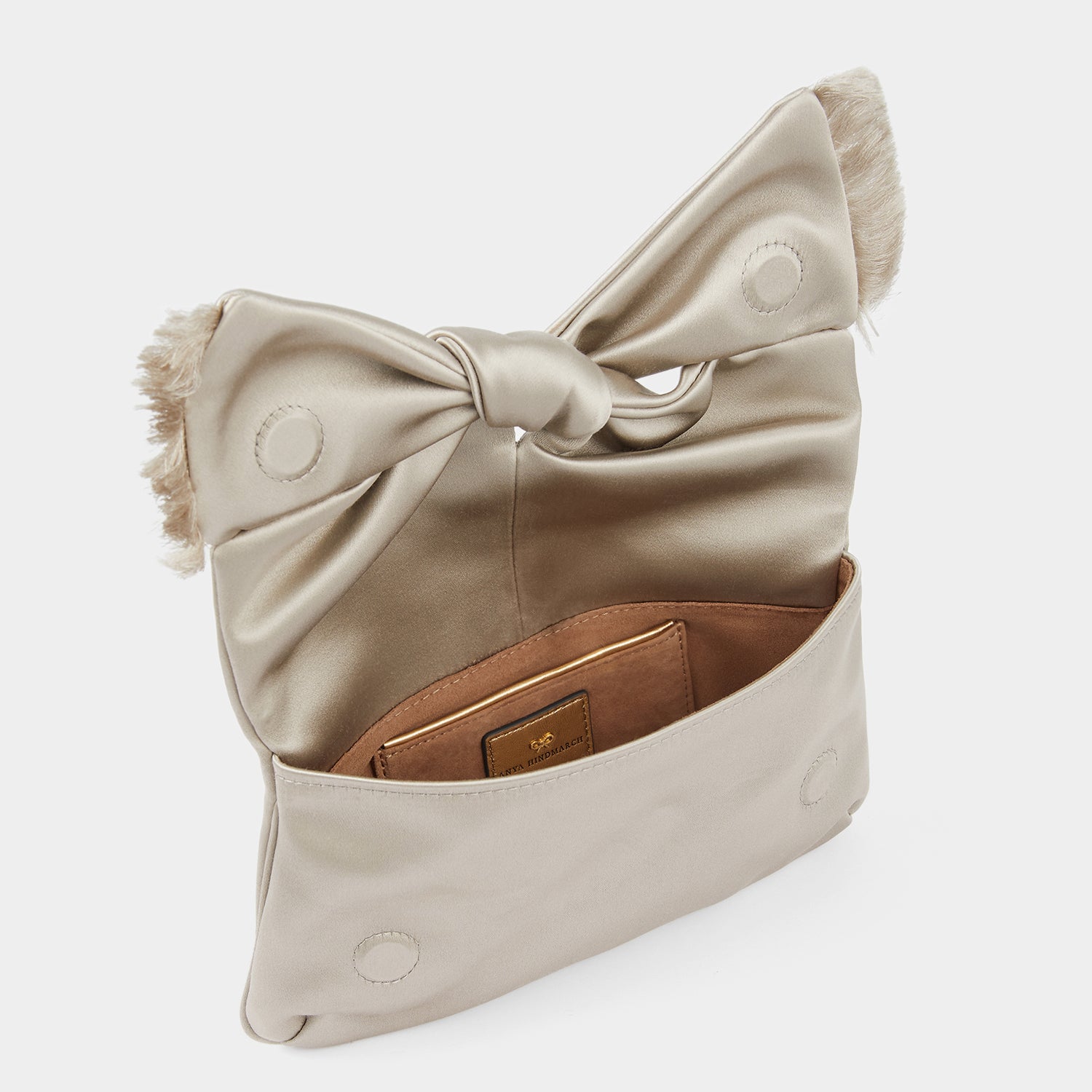 Bow Clutch -

                  
                    Satin in Silver -
                  

                  Anya Hindmarch UK
