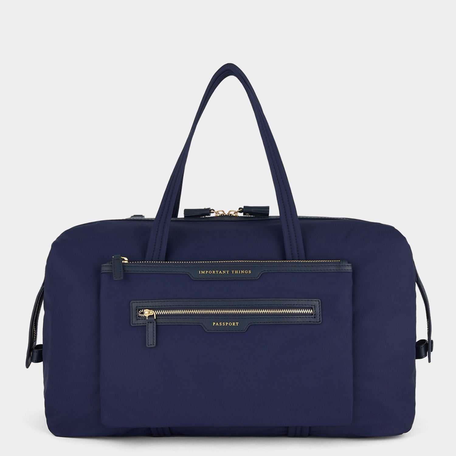 In-Flight Travel Bag -

                  
                    Regenerated Econyl® in Marine -
                  

                  Anya Hindmarch UK
