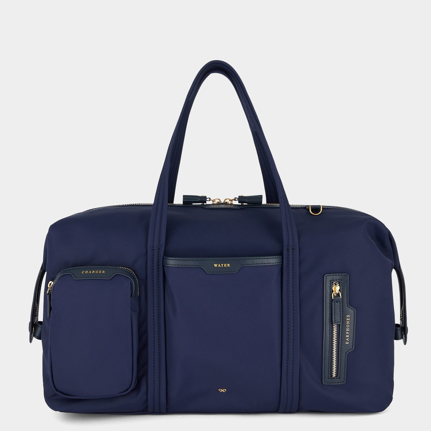 In-Flight Travel Bag -

                  
                    Regenerated Econyl® in Marine -
                  

                  Anya Hindmarch UK
