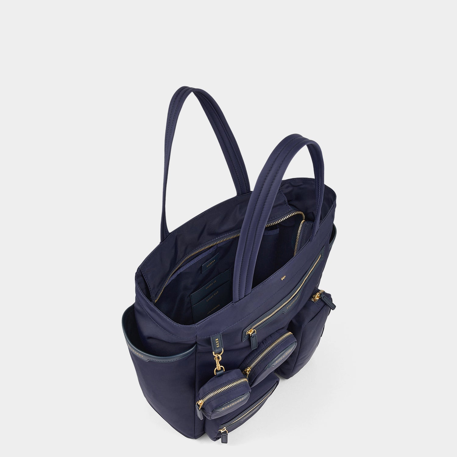 Commuter Tote -

                  
                    Regenerated Econyl® in Marine -
                  

                  Anya Hindmarch UK
