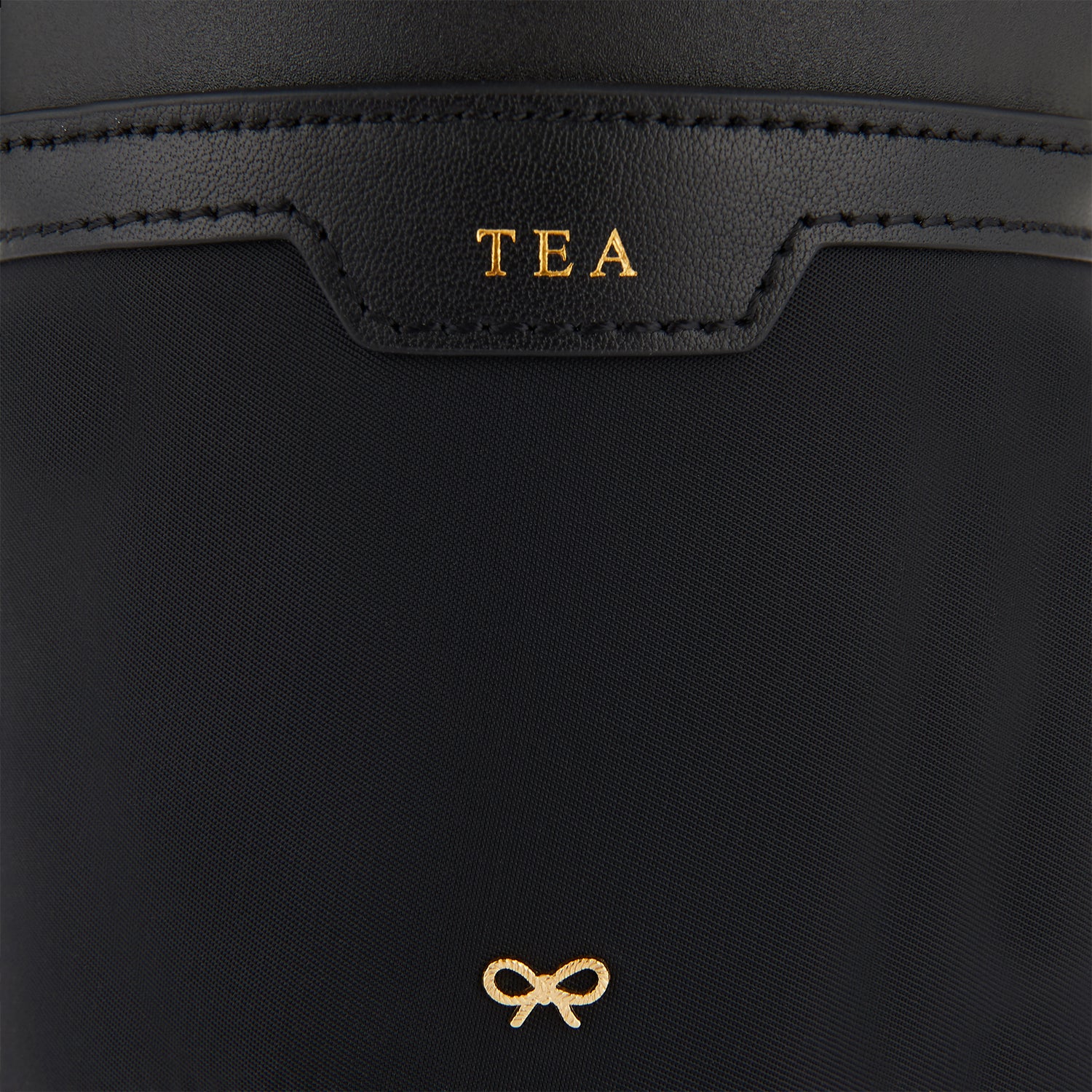 Cup Holder -

                  
                    ECONYL® Regenerated Nylon in Black -
                  

                  Anya Hindmarch UK
