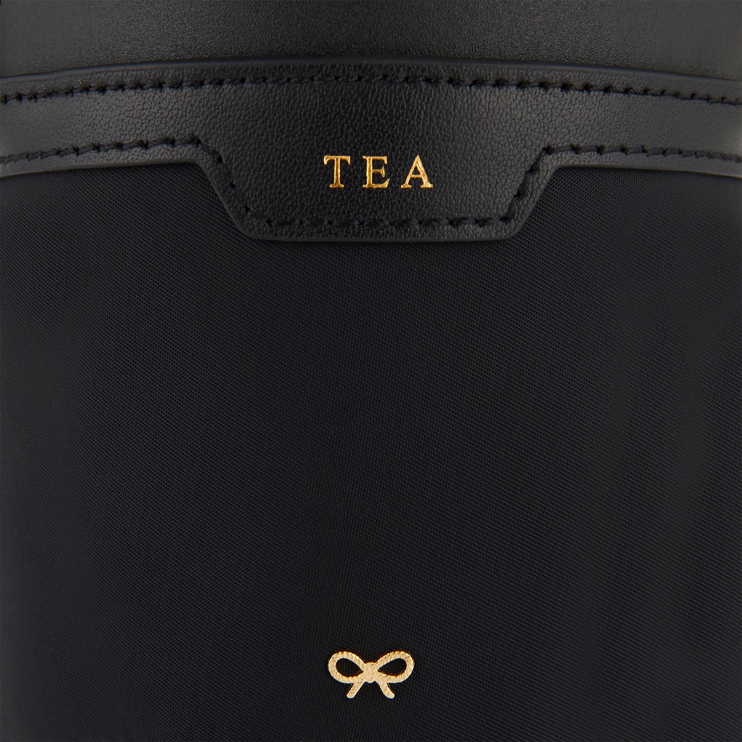 Cup Holder -

                  
                    Econyl® Regenerated Nylon in Black -
                  

                  Anya Hindmarch UK
