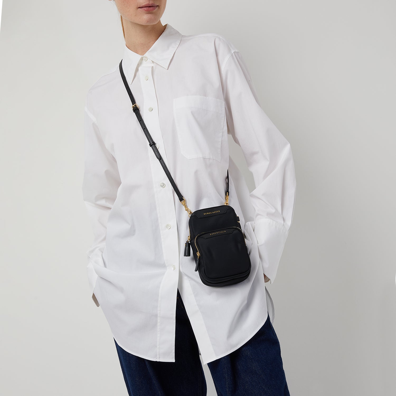 Essentials Cross-body -

                  
                    ECONYL® Regenerated Nylon in Black -
                  

                  Anya Hindmarch UK
