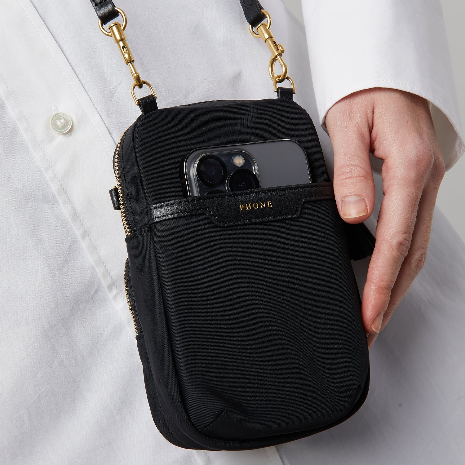 Essentials Cross-body -

                  
                    ECONYL® Regenerated Nylon in Black -
                  

                  Anya Hindmarch UK
