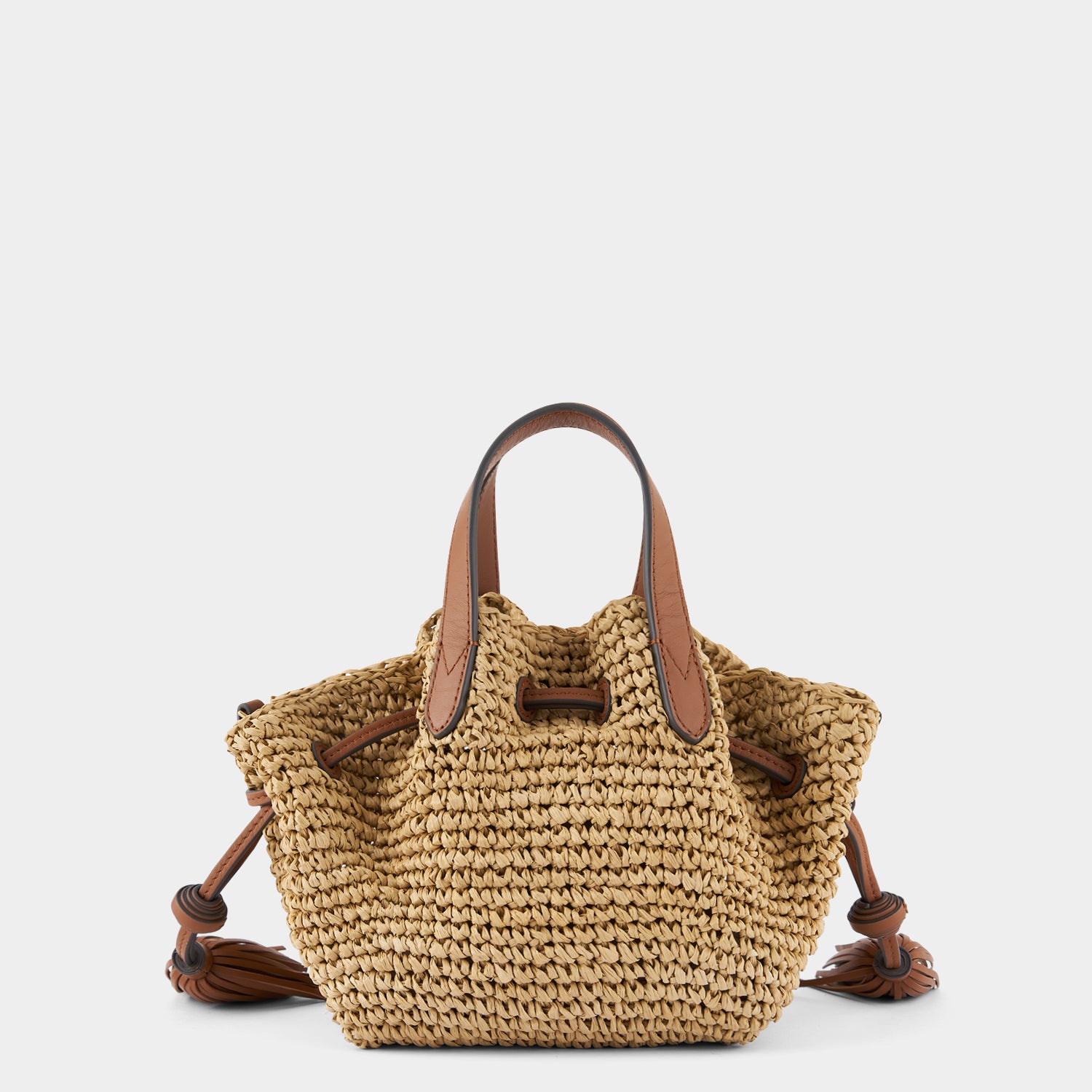 Raffia Drawstring Small Cross-body Tote -

                  
                    Natural Raffia/Leather in Tan -
                  

                  Anya Hindmarch UK
