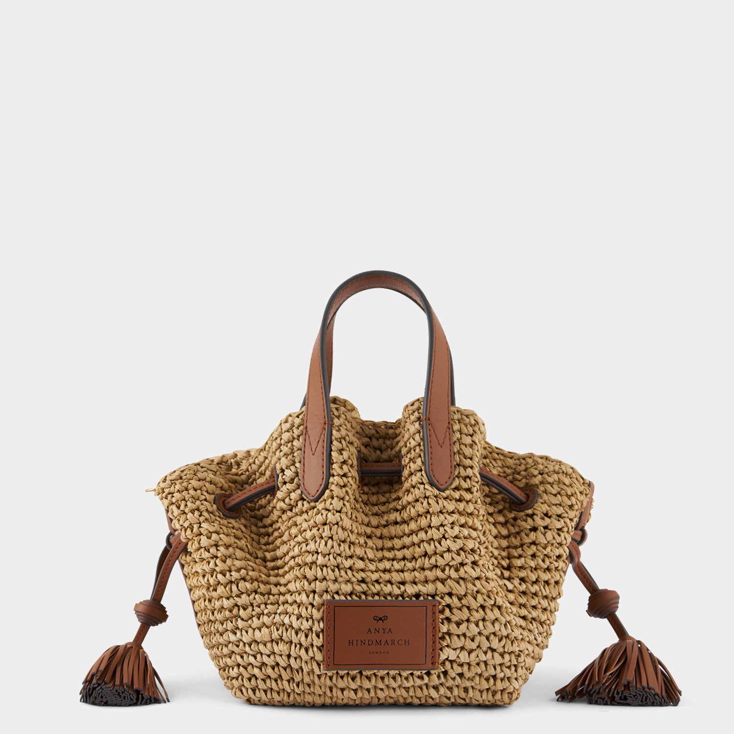 Raffia Drawstring Small Cross-body Tote -

                  
                    Natural Raffia/Leather in Tan -
                  

                  Anya Hindmarch UK
