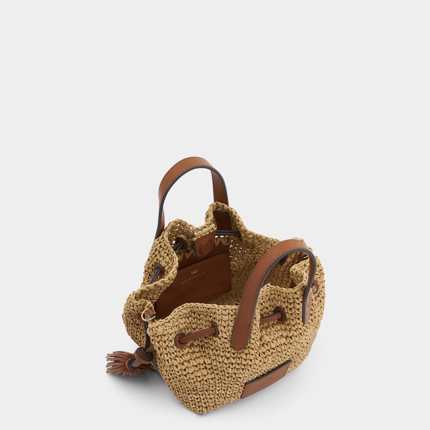 Raffia Drawstring Small Cross-body Tote -

                  
                    Natural Raffia/Leather in Tan -
                  

                  Anya Hindmarch UK
