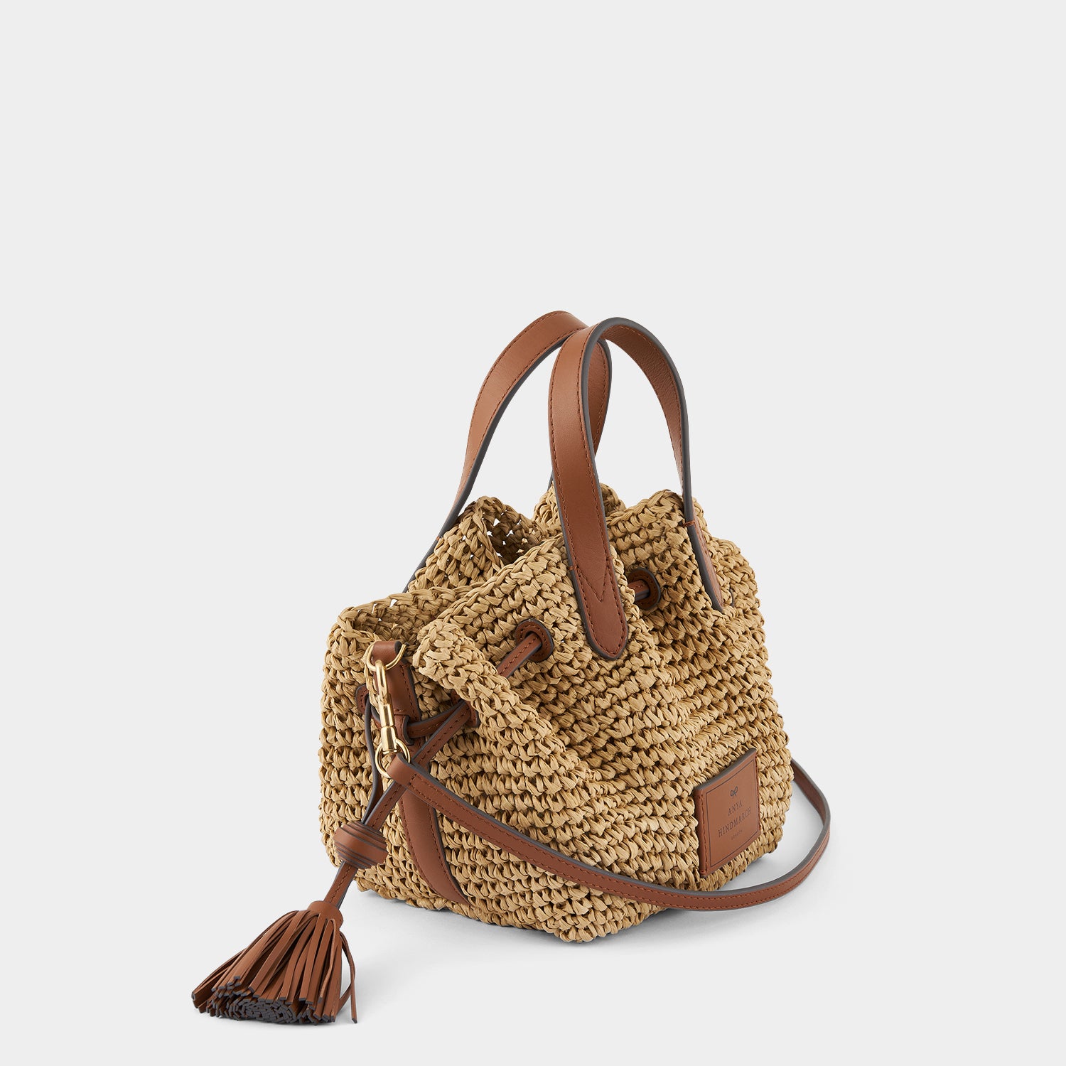 Raffia Drawstring Small Cross-body Tote -

                  
                    Natural Raffia/Leather in Tan -
                  

                  Anya Hindmarch UK
