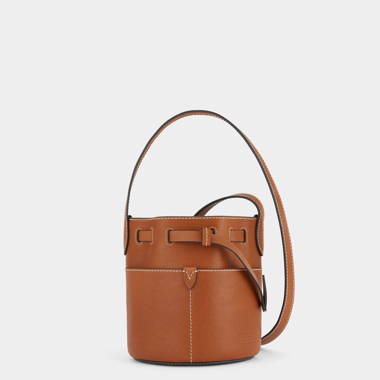 Return to Nature Mini Bucket Bag -

                  
                    Compostable Leather in Tan -
                  

                  Anya Hindmarch UK
