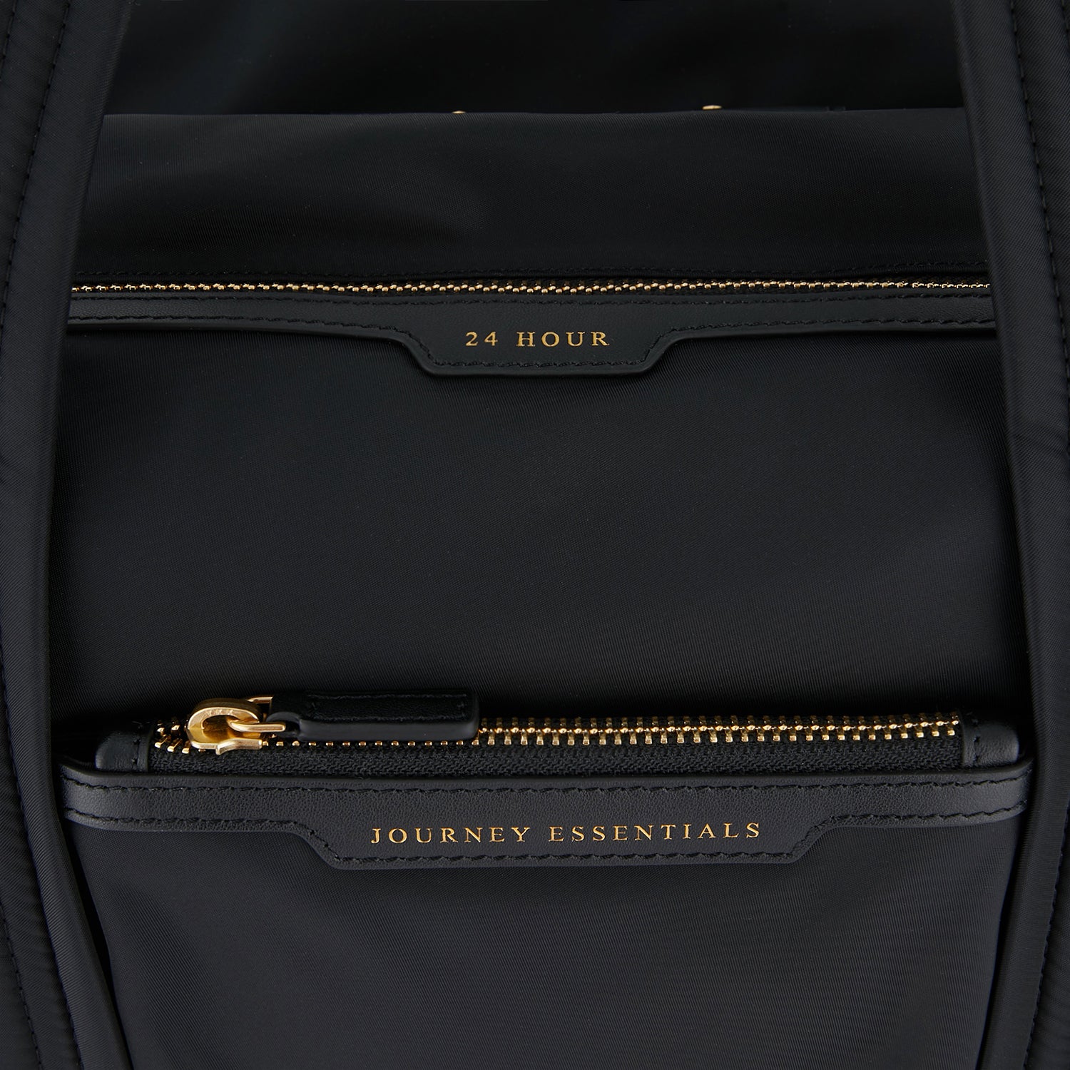 24 Hour Travel Bag -

                  
                    Econyl® Regenerated Nylon in Black -
                  

                  Anya Hindmarch UK
