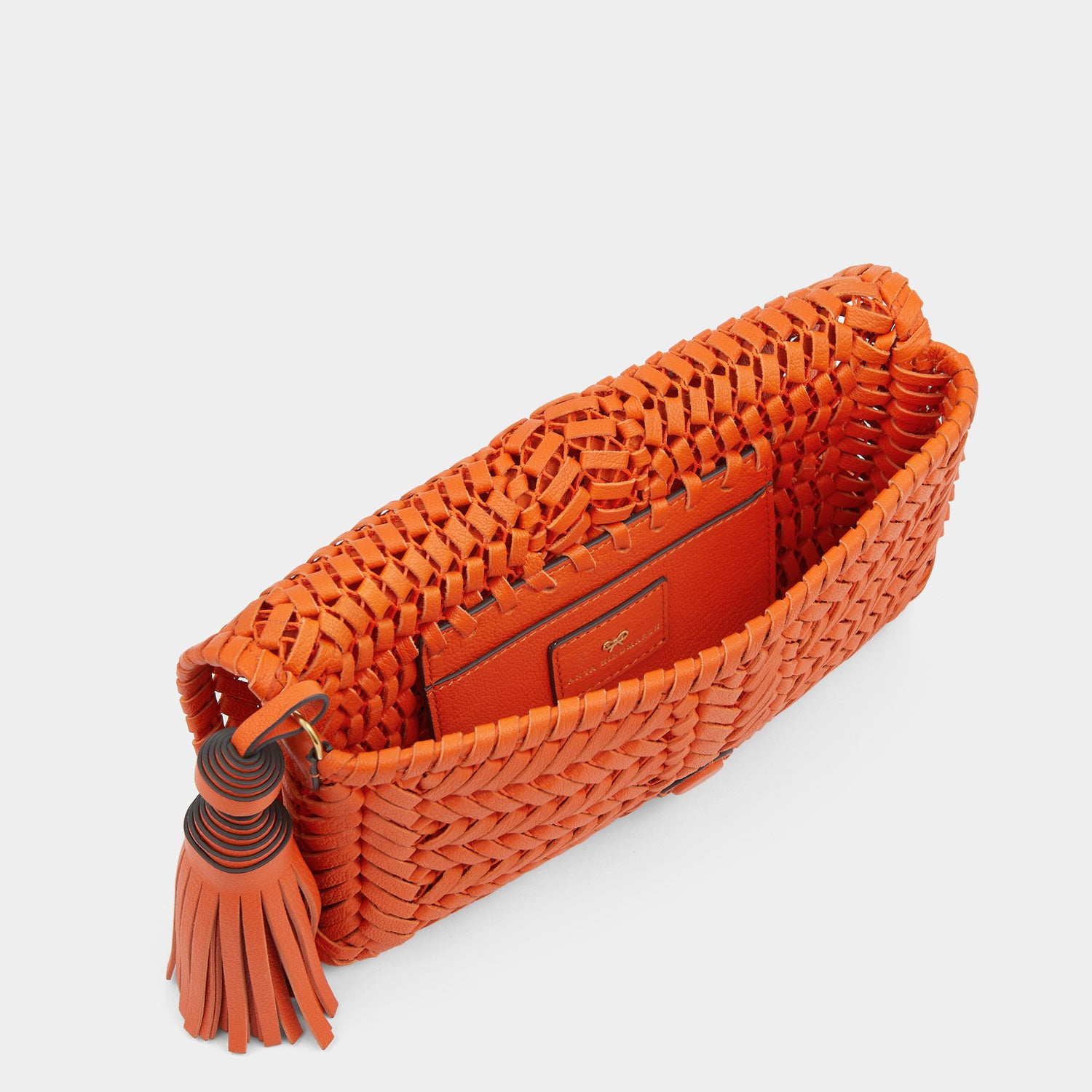 Neeson Tassel Clutch -

                  
                    Capra Leather in Ginger -
                  

                  Anya Hindmarch UK
