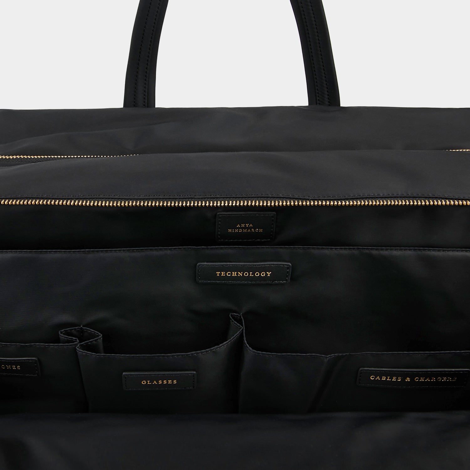 24 Hour Travel Bag -

                  
                    Econyl® Regenerated Nylon in Black -
                  

                  Anya Hindmarch UK

